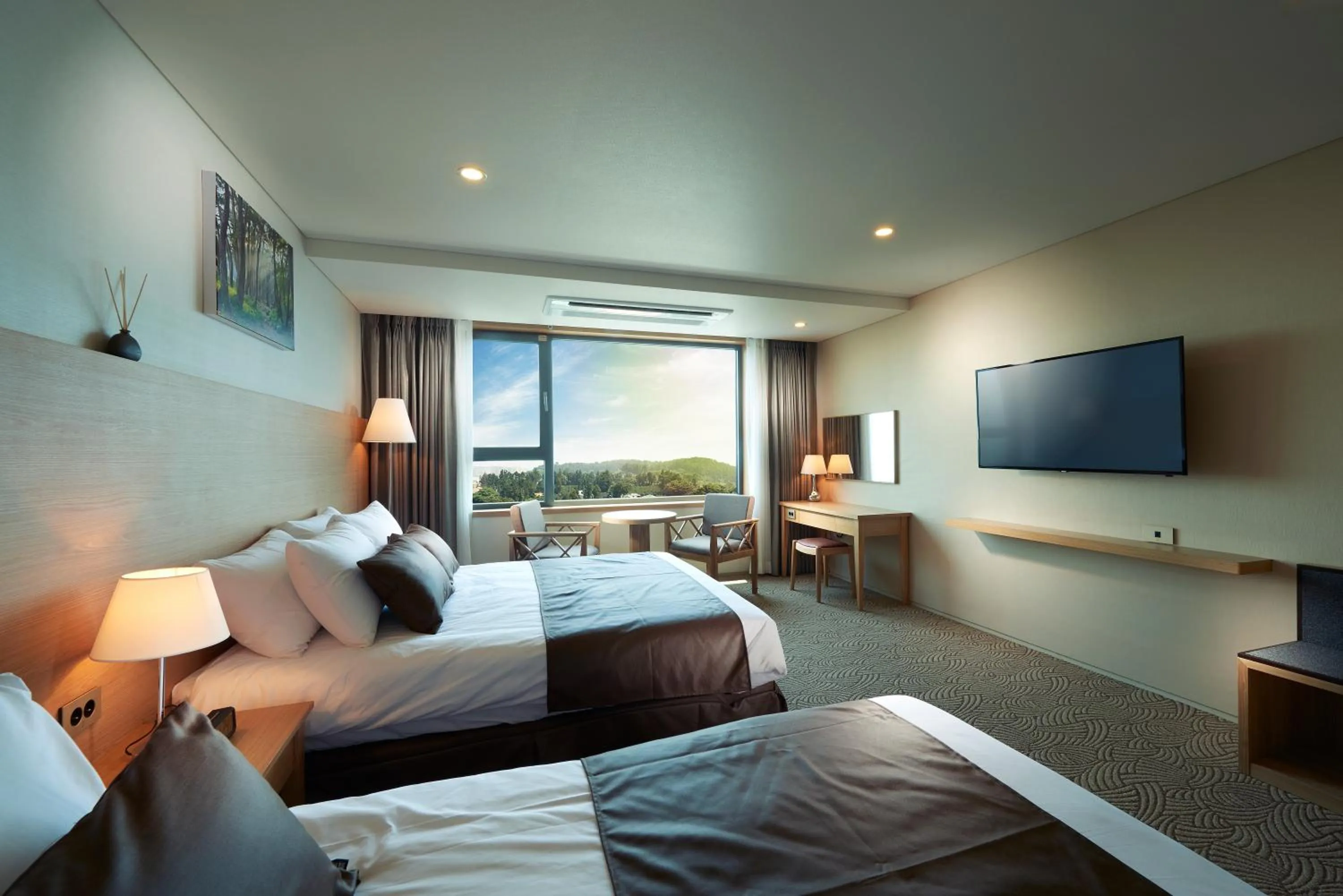 Bed in Benikea Jungmun Hotel