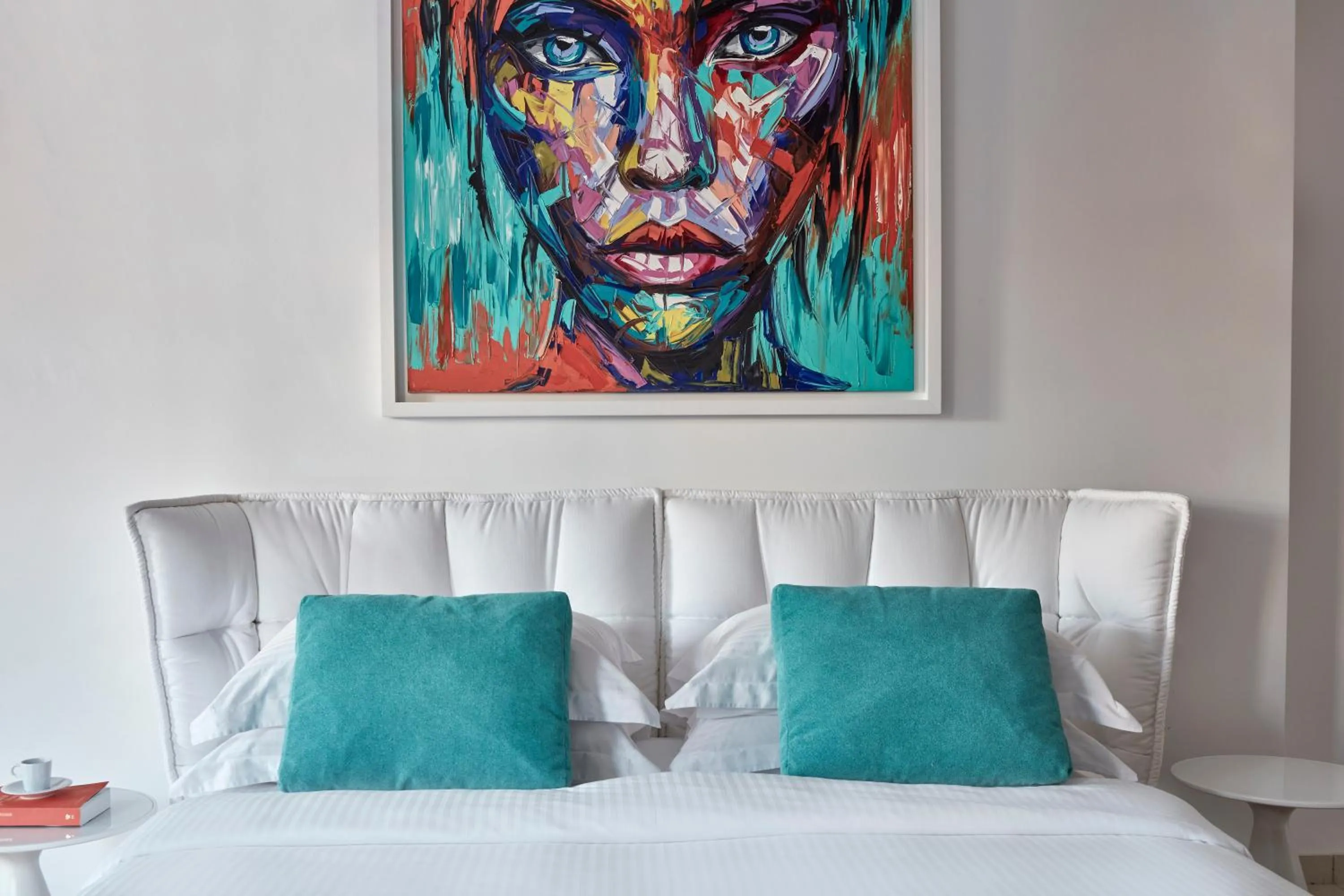 Bed in Myconian Ambassador Relais & Chateaux