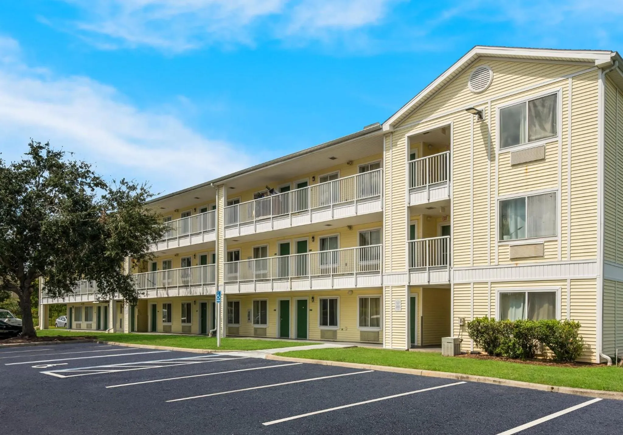 Property building in HomeTowne Studios by Red Roof Orlando - UCF Area