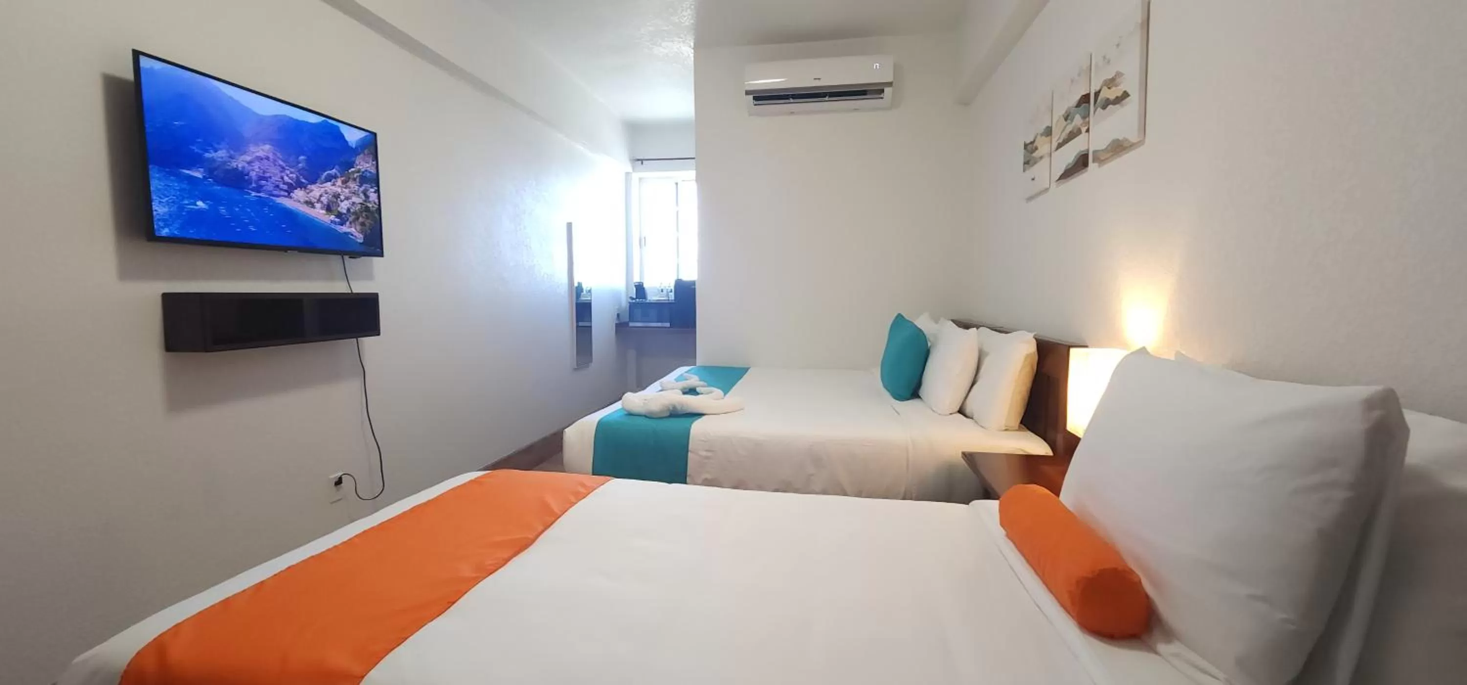 Bed in Voyager Sun & Reef Hotel