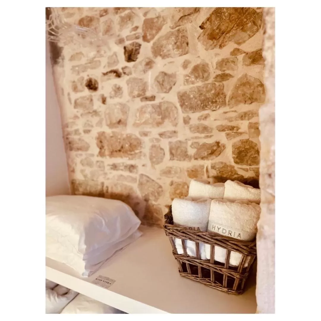 Bed in Hydria guest house art gallery