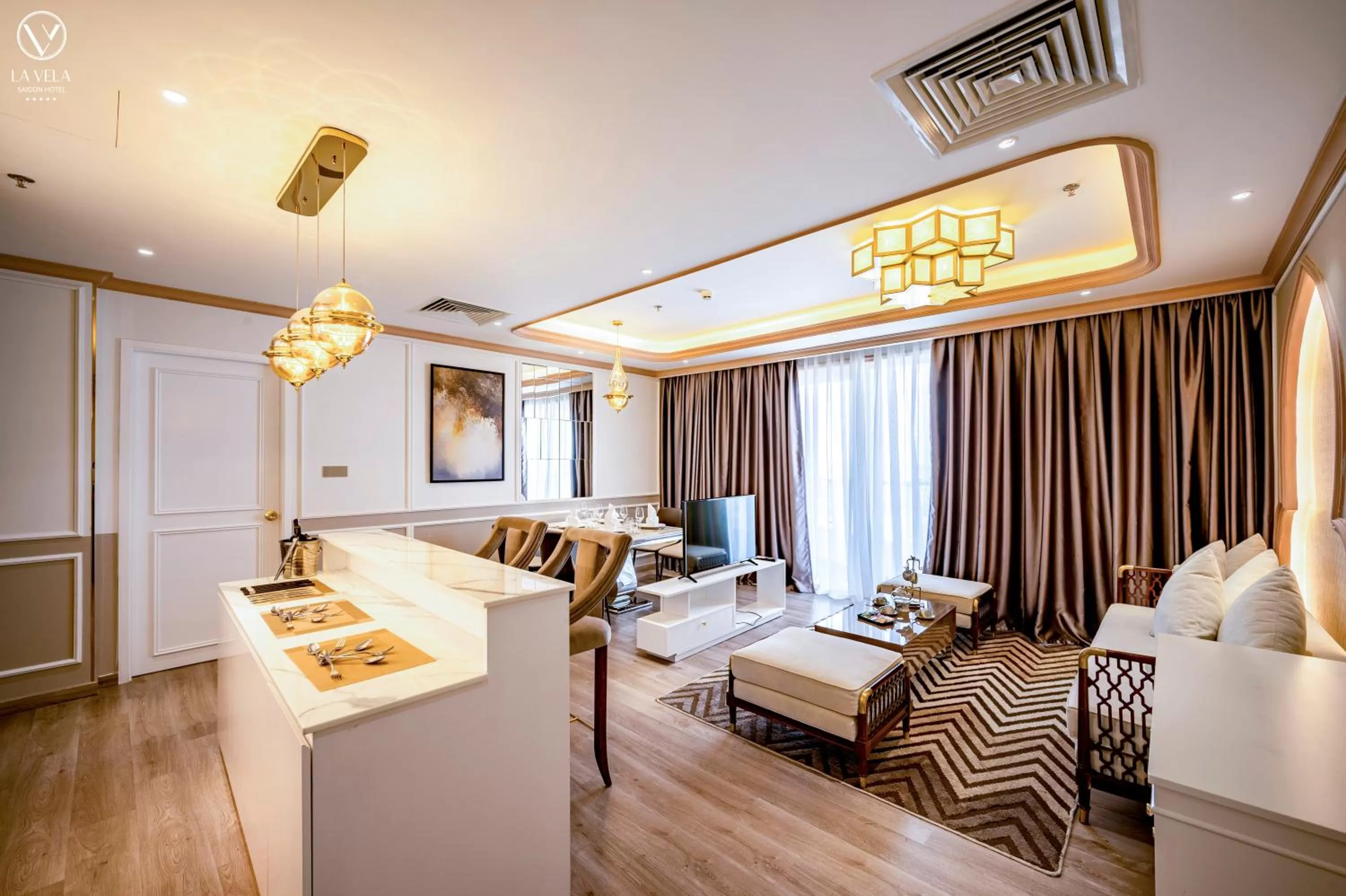 Living room, Bed in La Vela Saigon Hotel