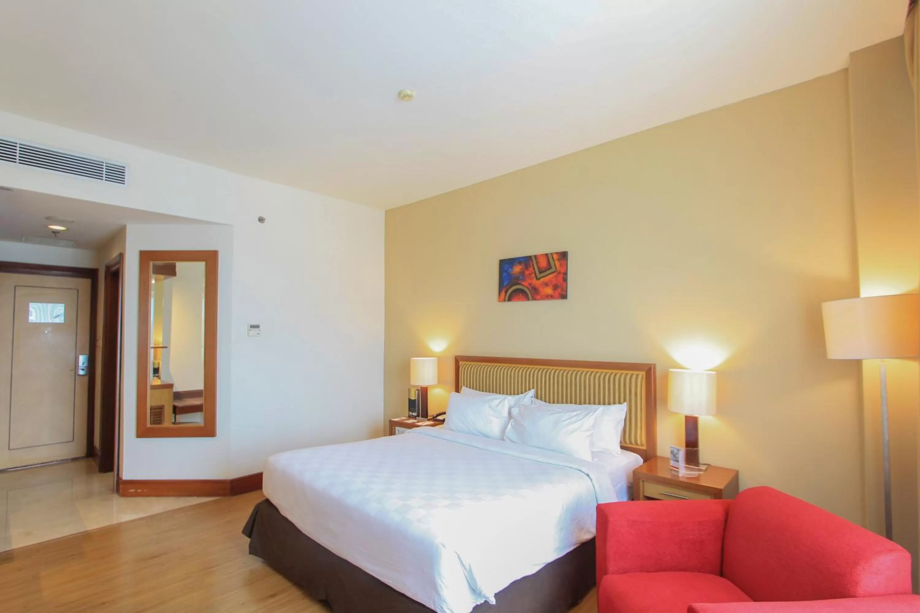 Bed in Swiss-Belhotel Maleosan Manado