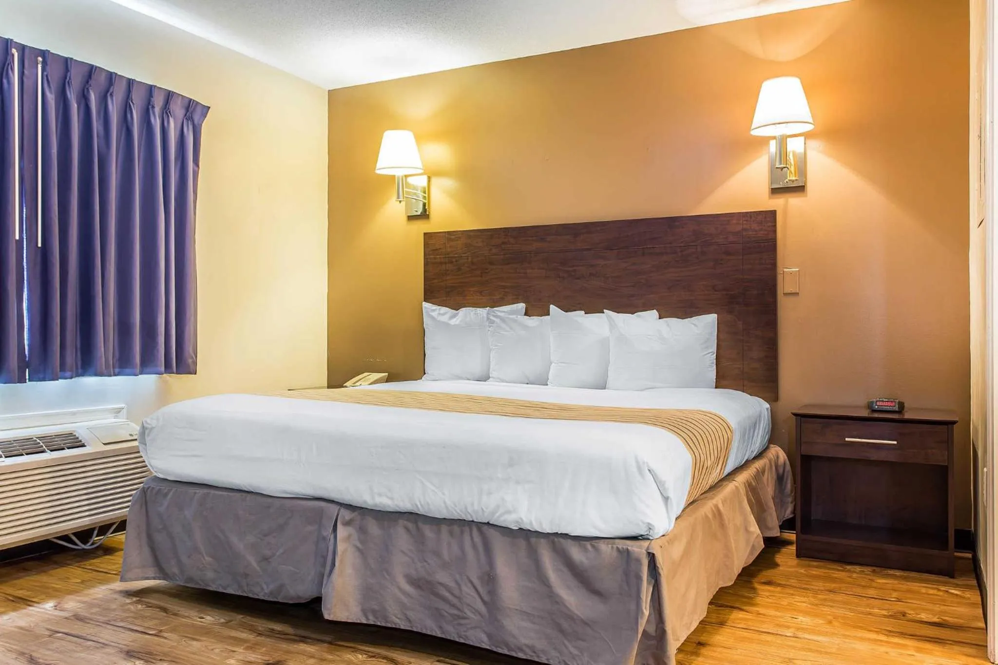 Photo of the whole room, Bed in Suburban Studios near University of North Carolina-Charlotte