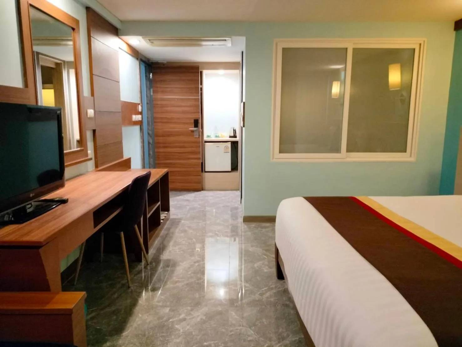 Bed in Saisawan Beach Luxury Hotel