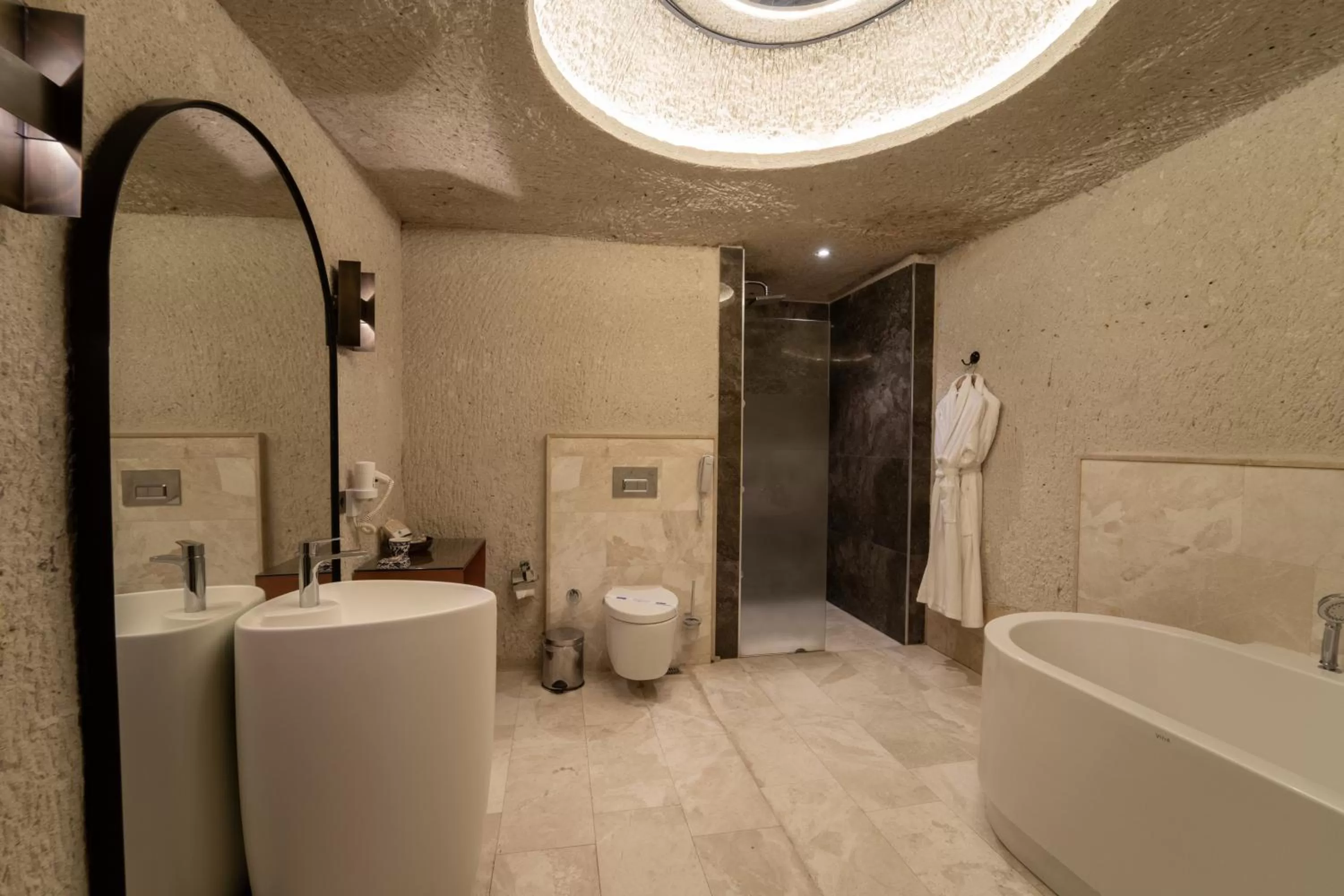 Bathroom in Artemis Cave Suites & Spa- Adults Only