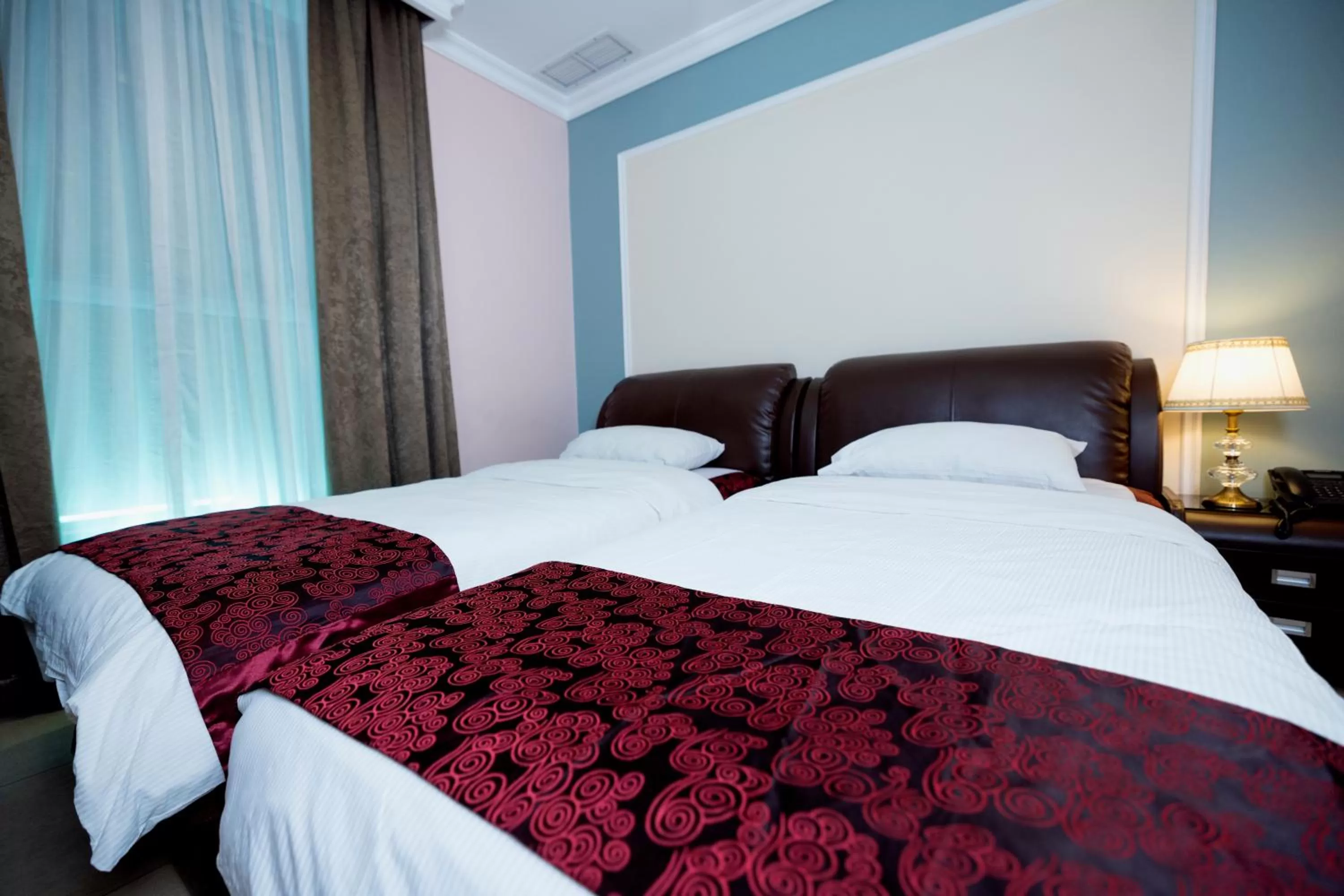 Bed in Laguna Hotel Suites