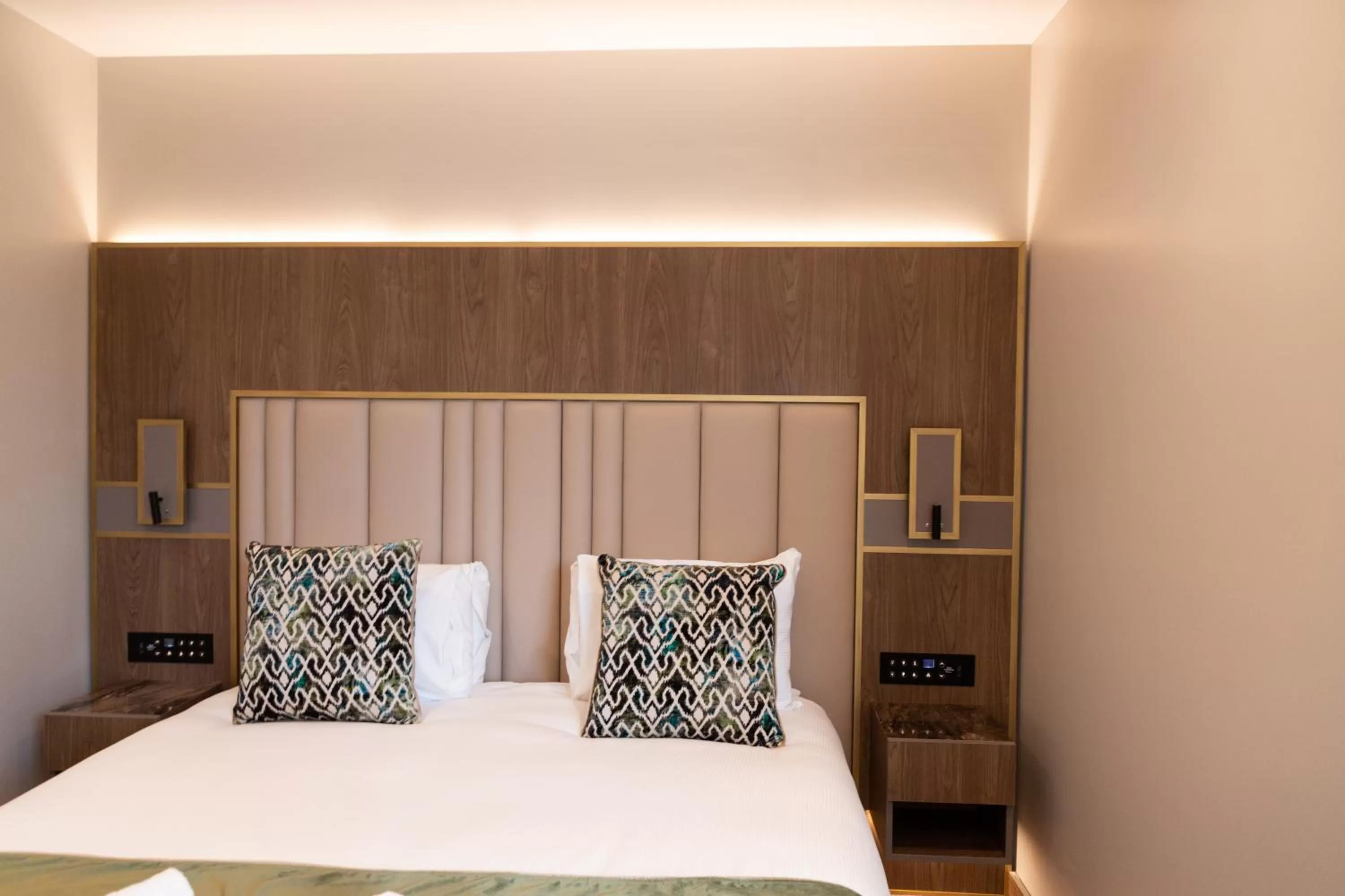 Bed in Merit Kensington Hotel