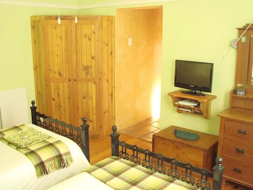 Bedroom, TV/Entertainment Center in The Farmhouse B&B