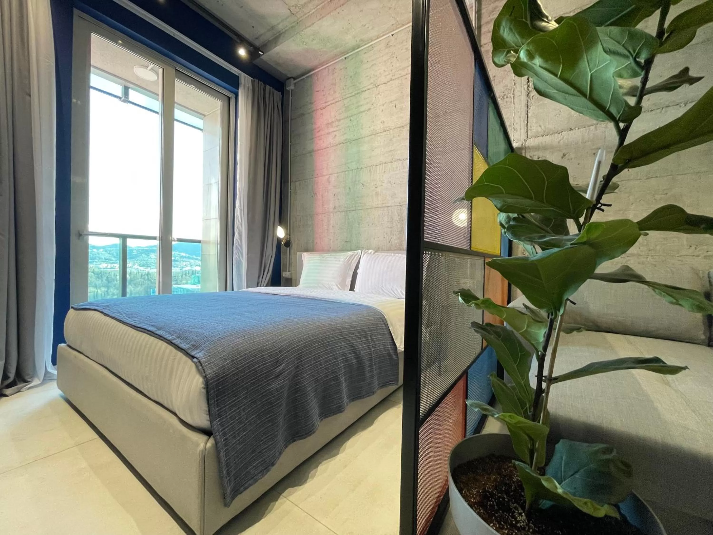 Bed in Ambassador Skyline Apartments