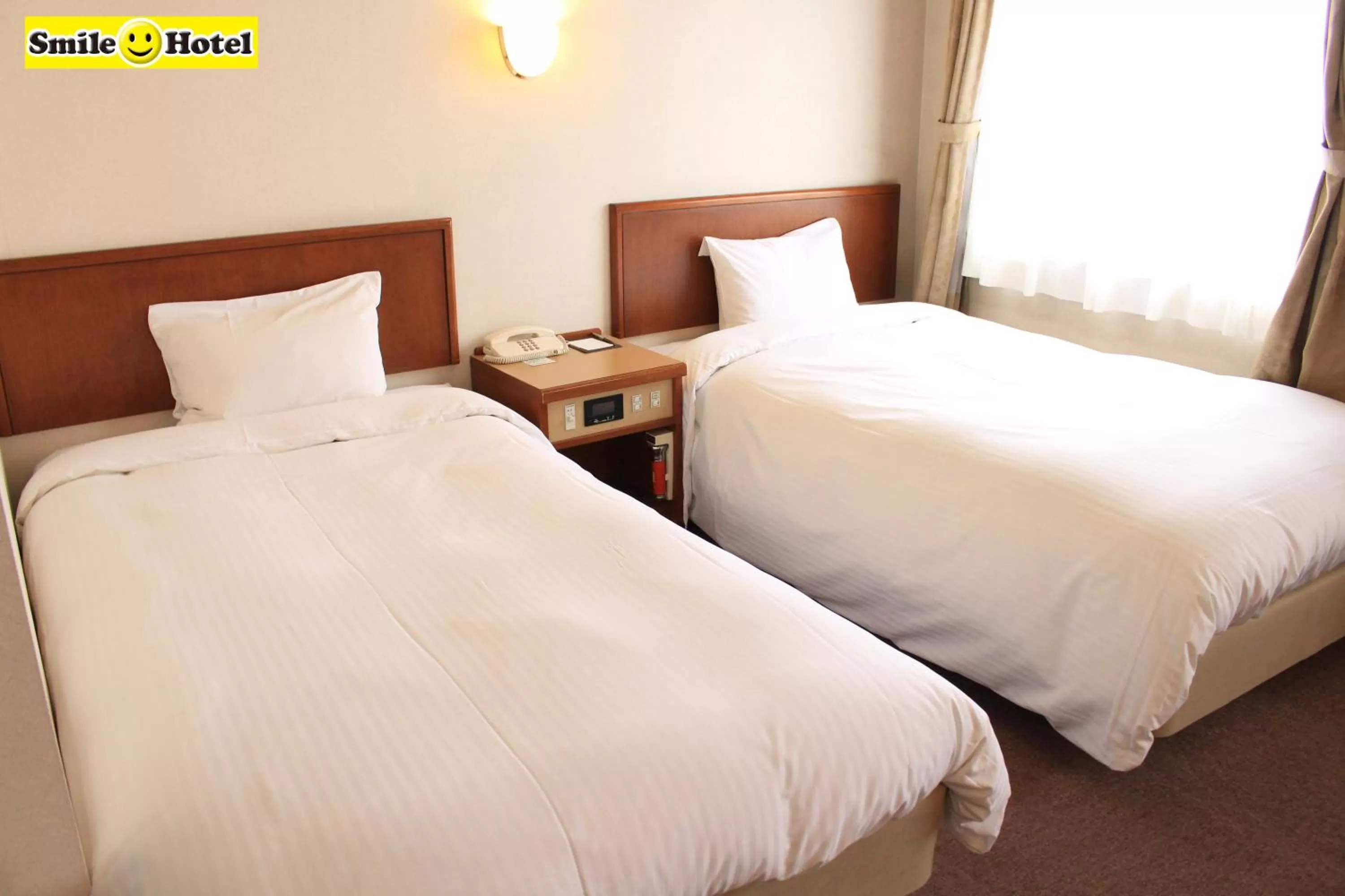 Bed in Smile Hotel Asahikawa