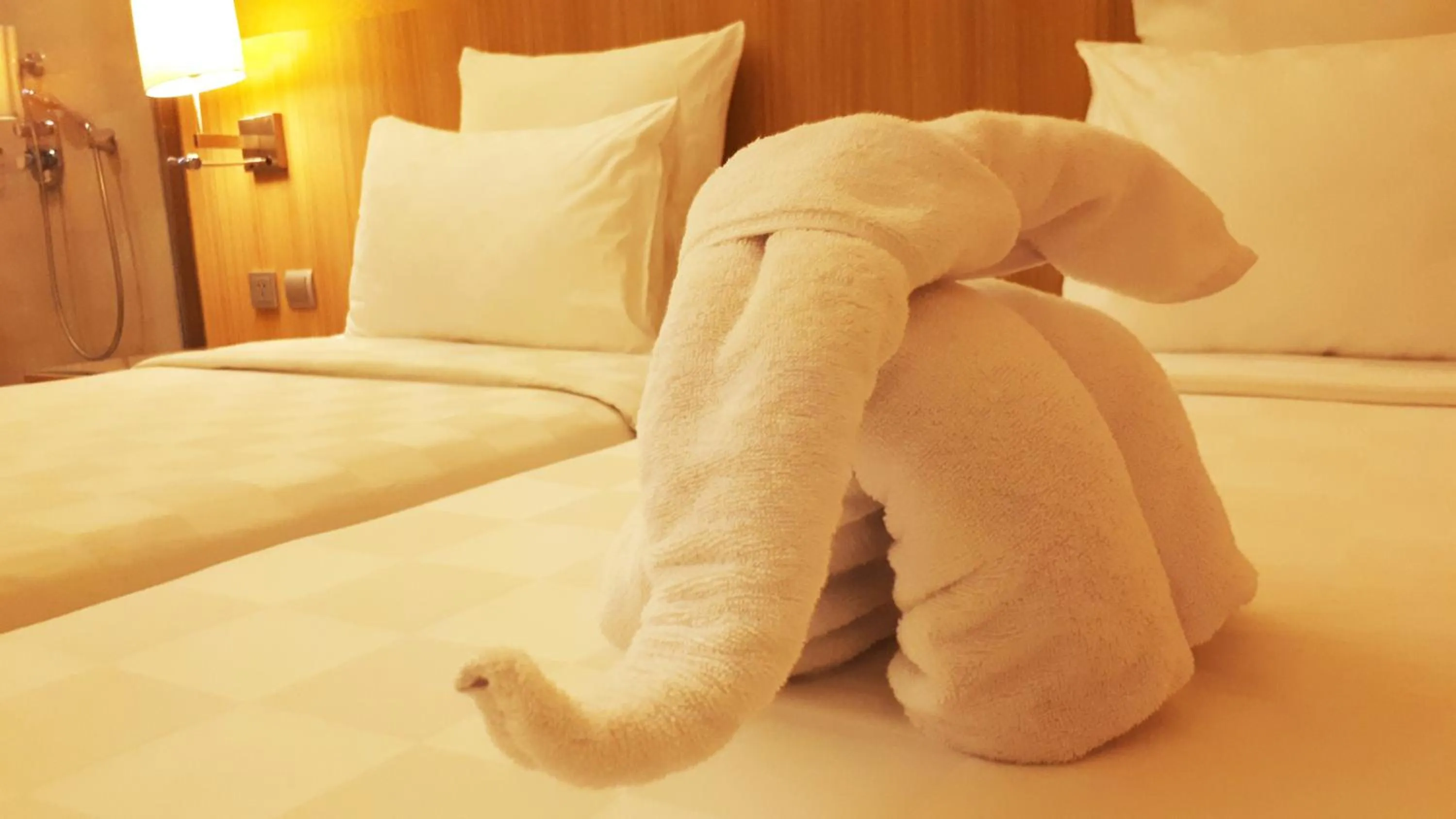 Bed in Novotel Surabaya Hotel