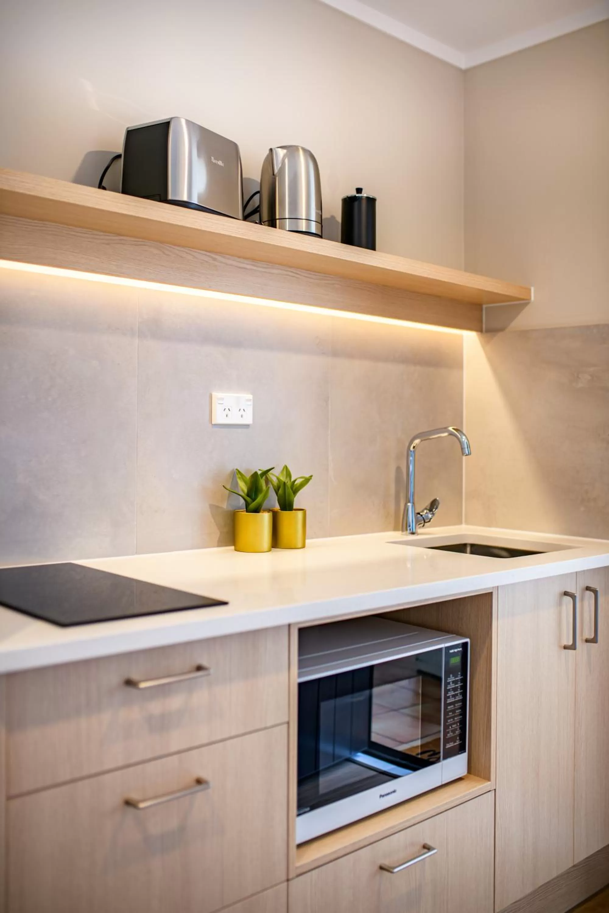 Kitchen or kitchenette in Takapuna International Motor Lodge