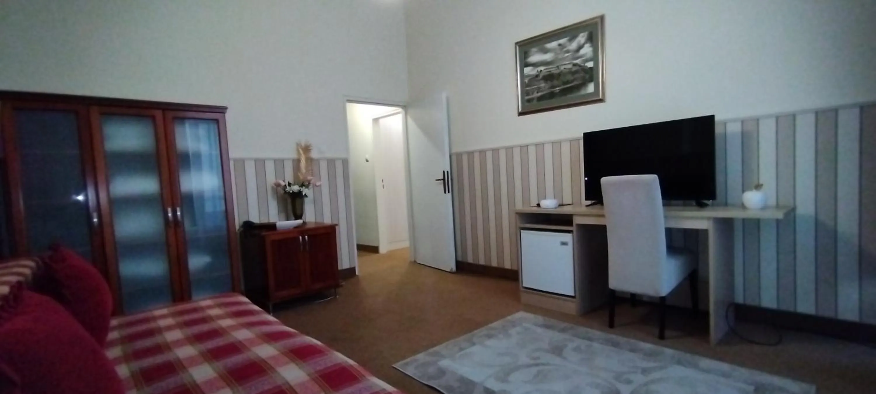 Living room, Bed in Hotel Vojvodina