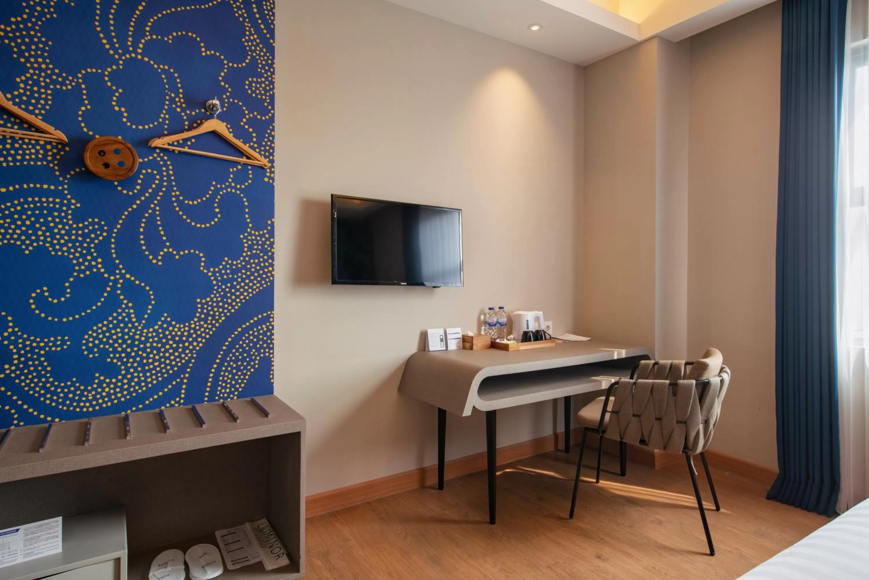 TV and multimedia in Luminor Hotel Airport Sidoarjo By WH , Best Choice and Strategic Location with a Rooftop area in Town