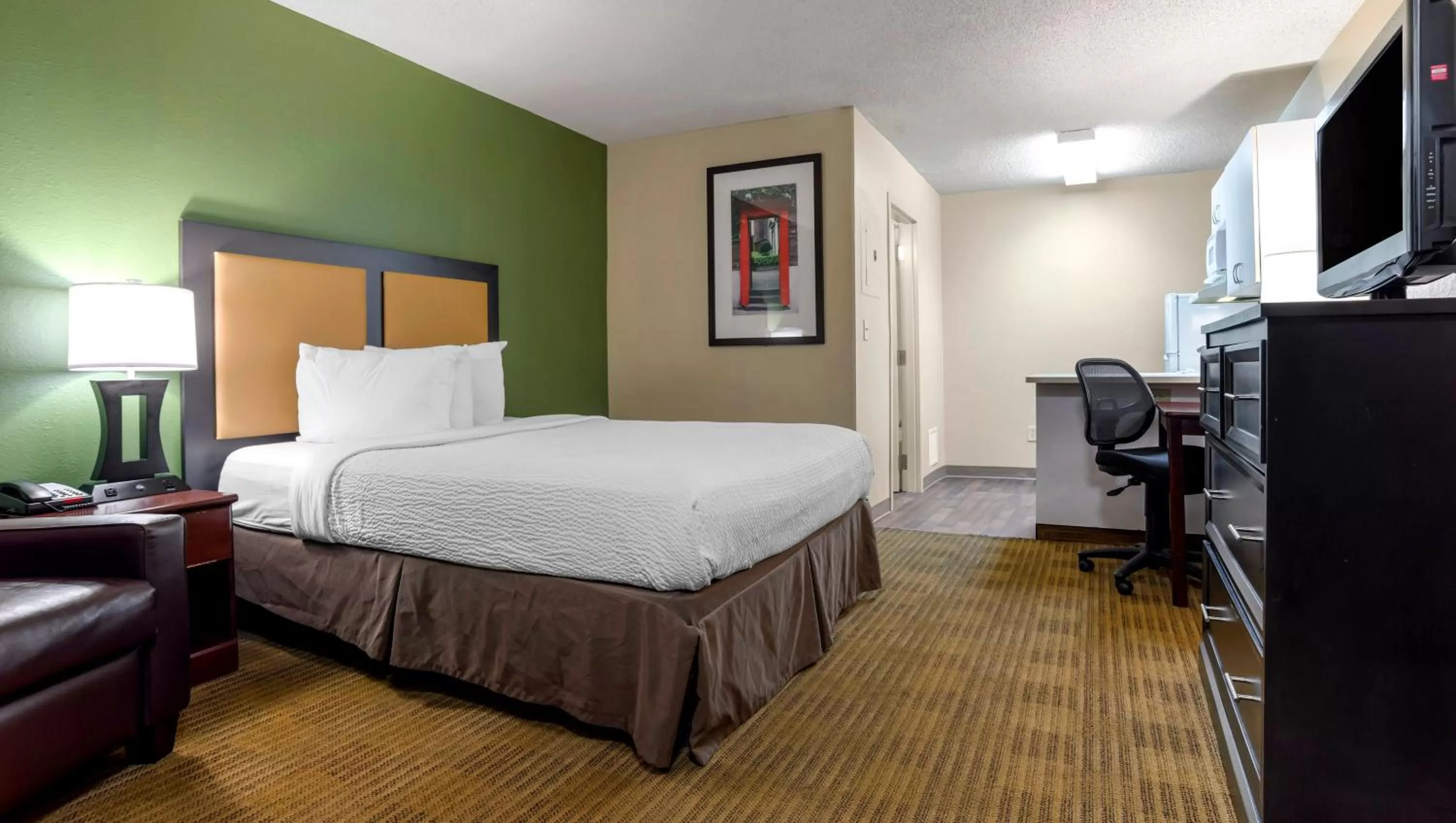 Bedroom, Bed in Home 1 Suites Extended Stay