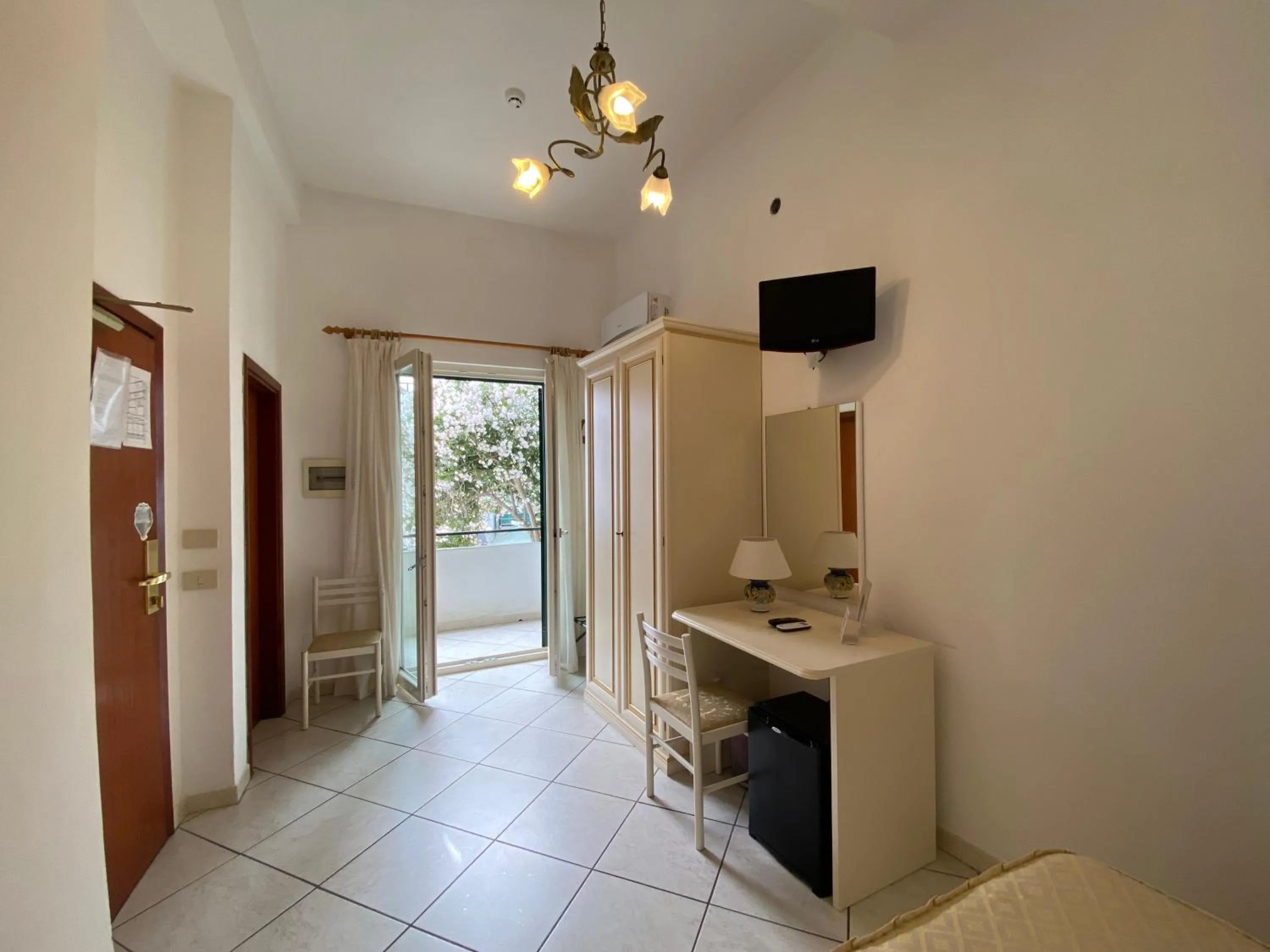 Bedroom in Hotel La Perla