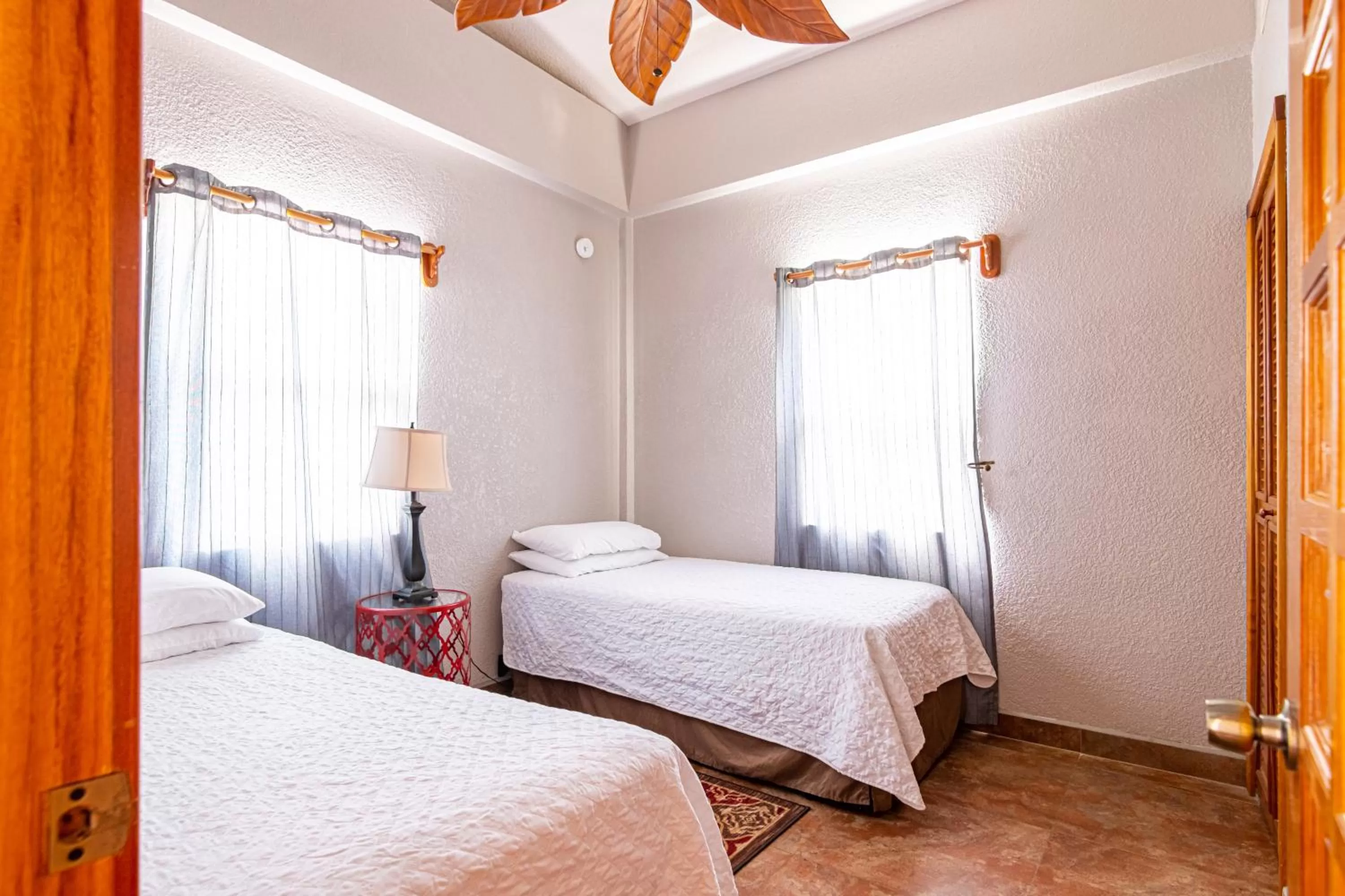 Bed in Lighthouse Beach Villas