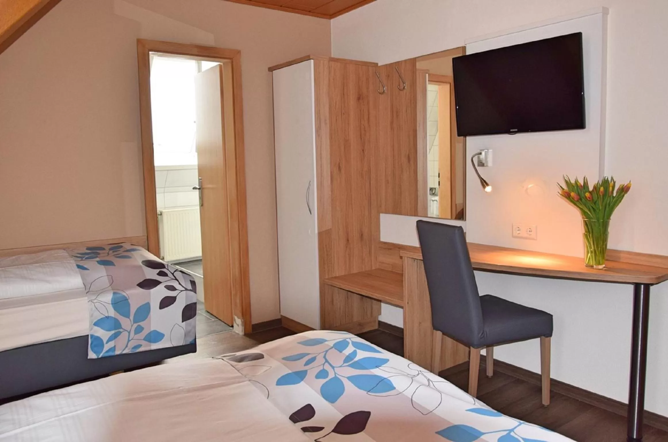 Bedroom, TV/Entertainment Center in Cafe-Hotel Altreuter