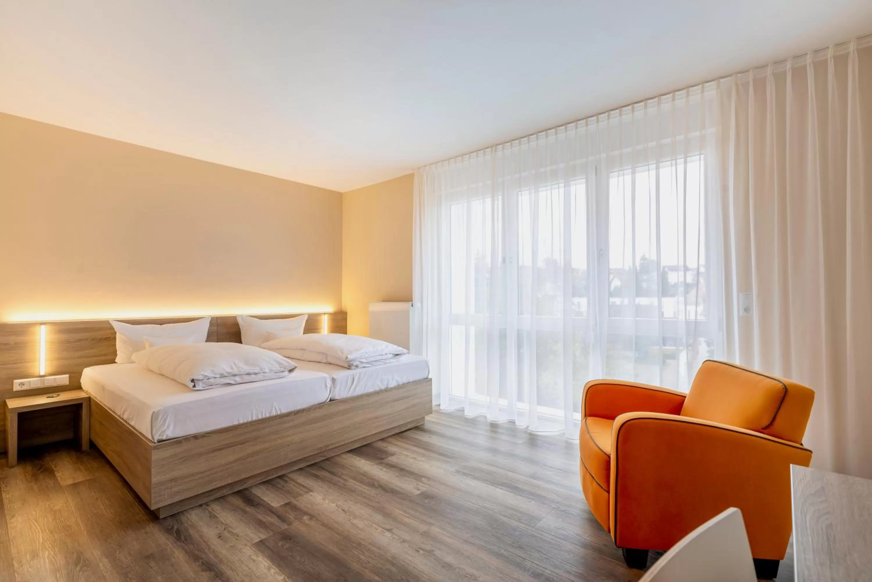 Photo of the whole room, Bed in Hotel Goll Pforzheim-Niefern