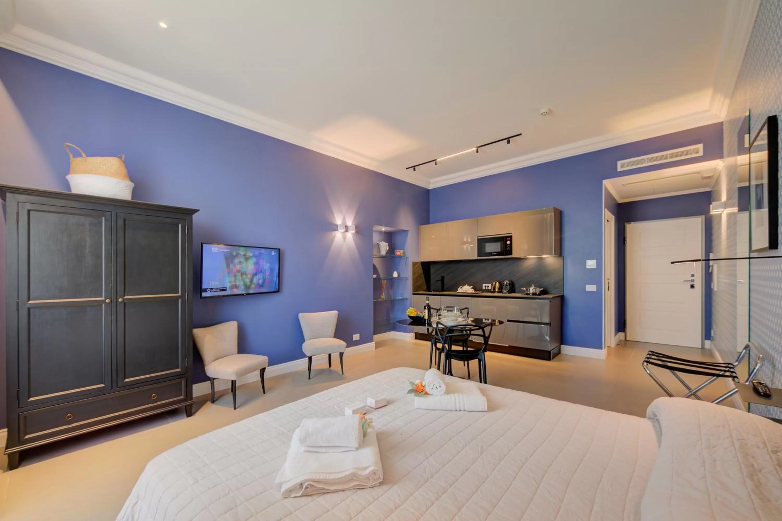 Living room, TV/Entertainment Center in Boutique Central Apartments- Happy Rentals