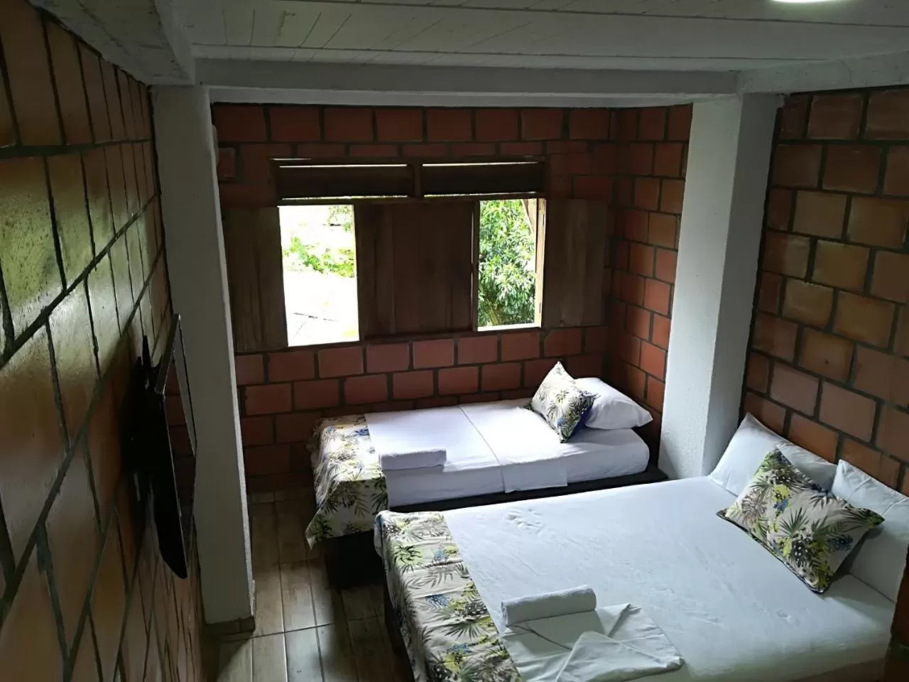 Bed, Seating Area in Hotel Acuali Nuqui