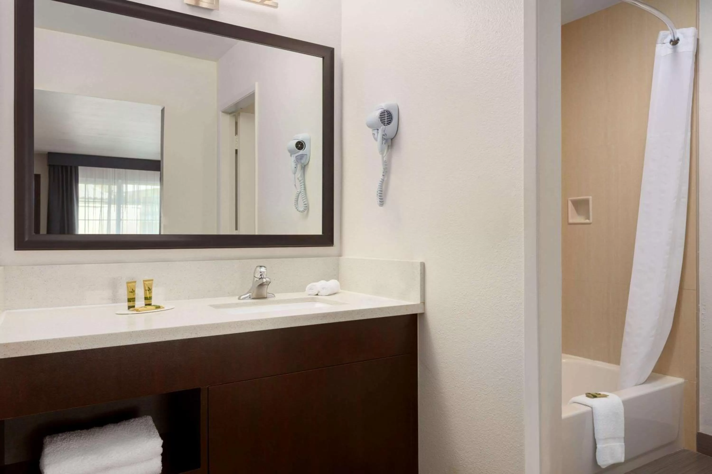 Bathroom in Days Inn & Suites by Wyndham Anaheim At Disneyland Park