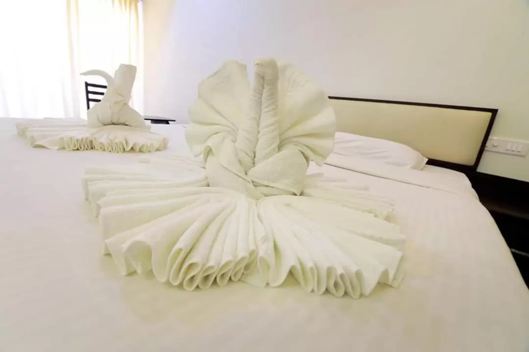 Bed in Hotel Ambai Grand