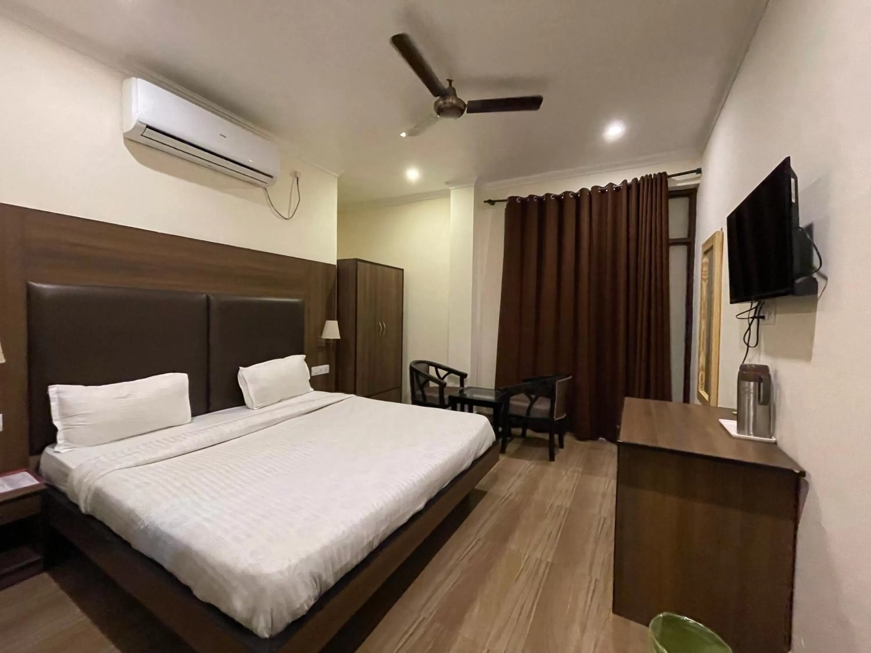 Photo of the whole room, Bed in Tapasthali by Meera Hotels