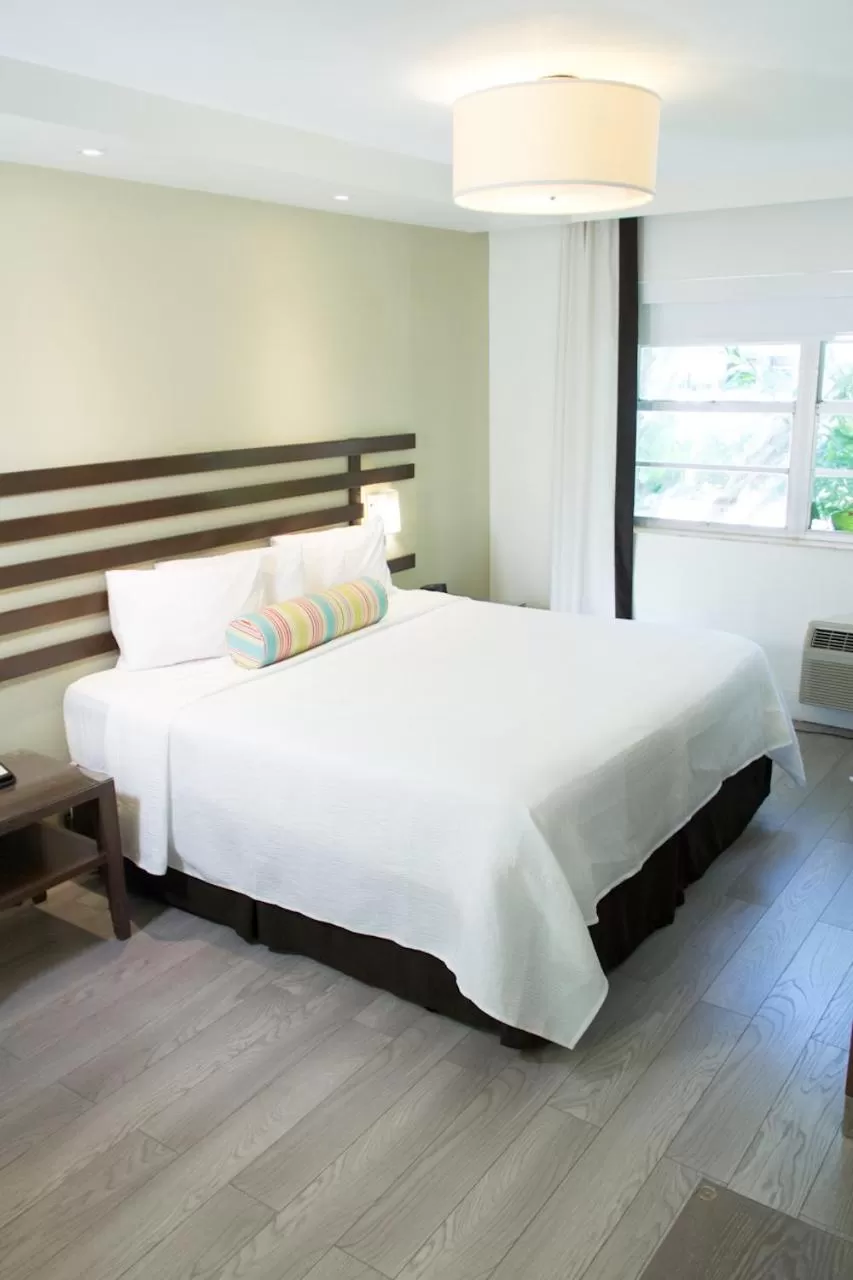 Bed in Dorchester Hotel & Suites