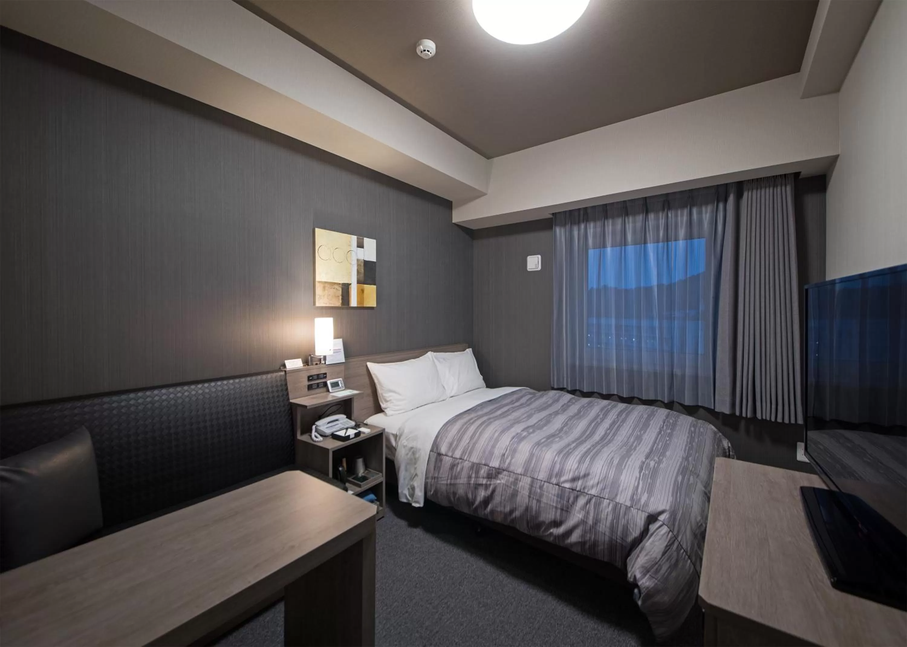 Photo of the whole room, Bed in Hotel Route-Inn Hamada Ekimae