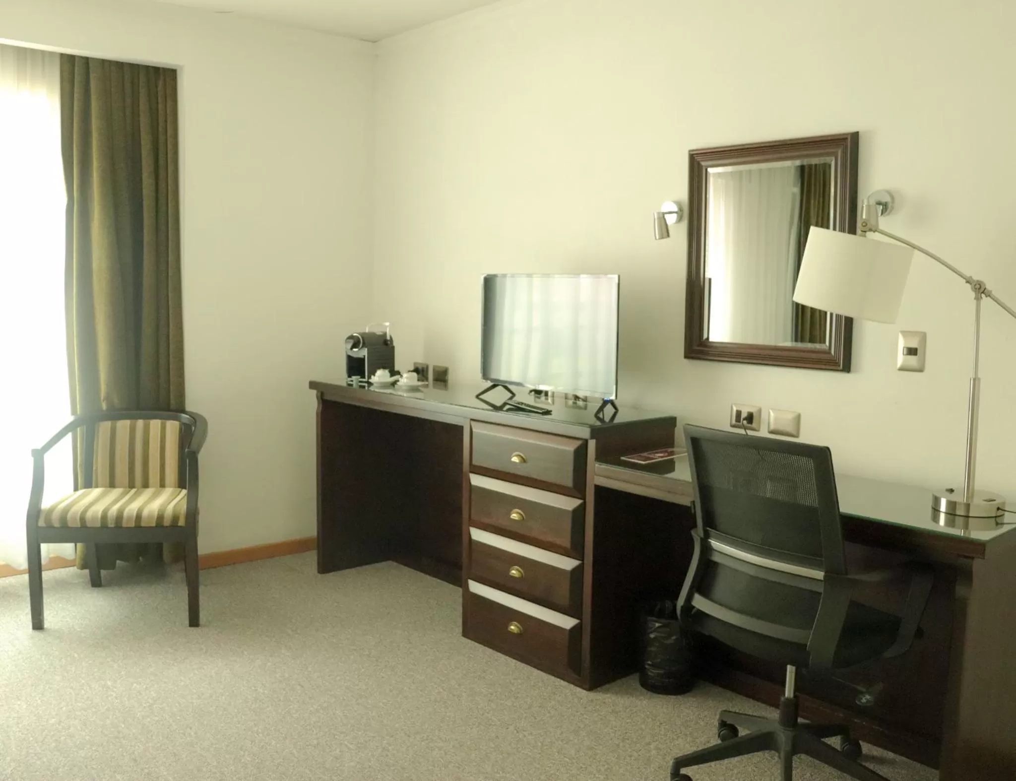 TV and multimedia, TV/Entertainment Center in Hotel Terrano Concepción