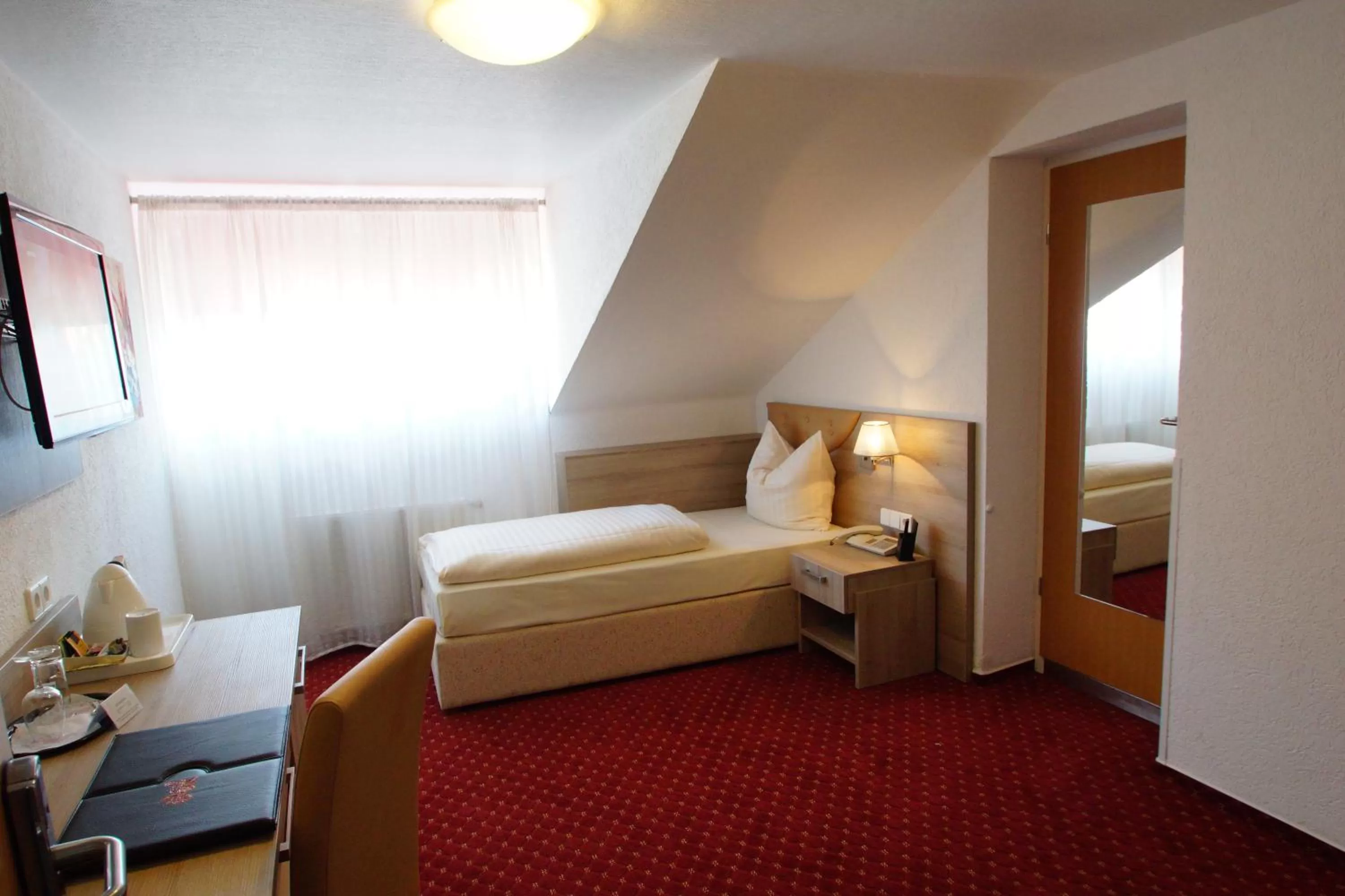 Bed in Airport Hotel Filder Post