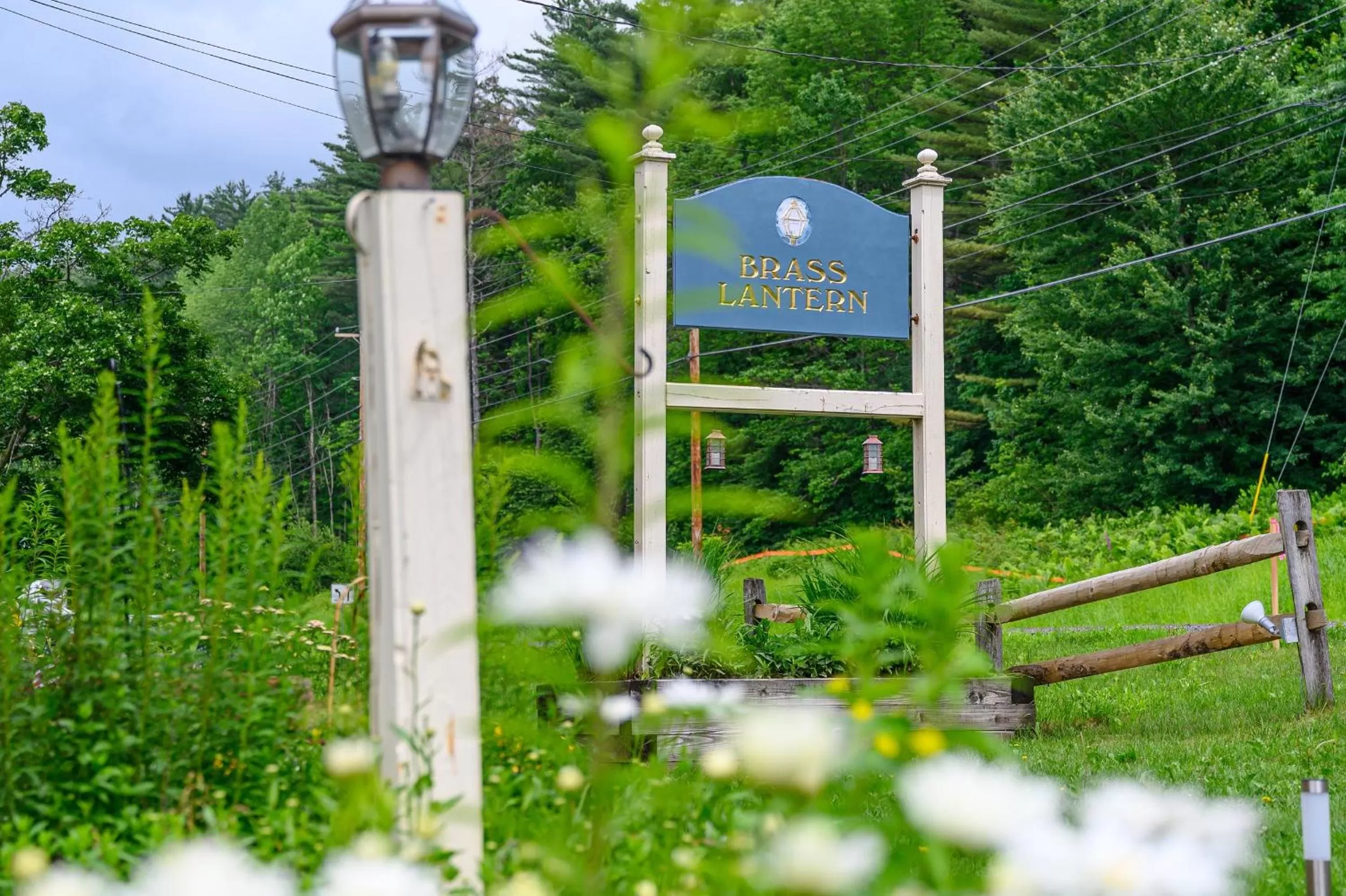 Property logo or sign in Brass Lantern Inn
