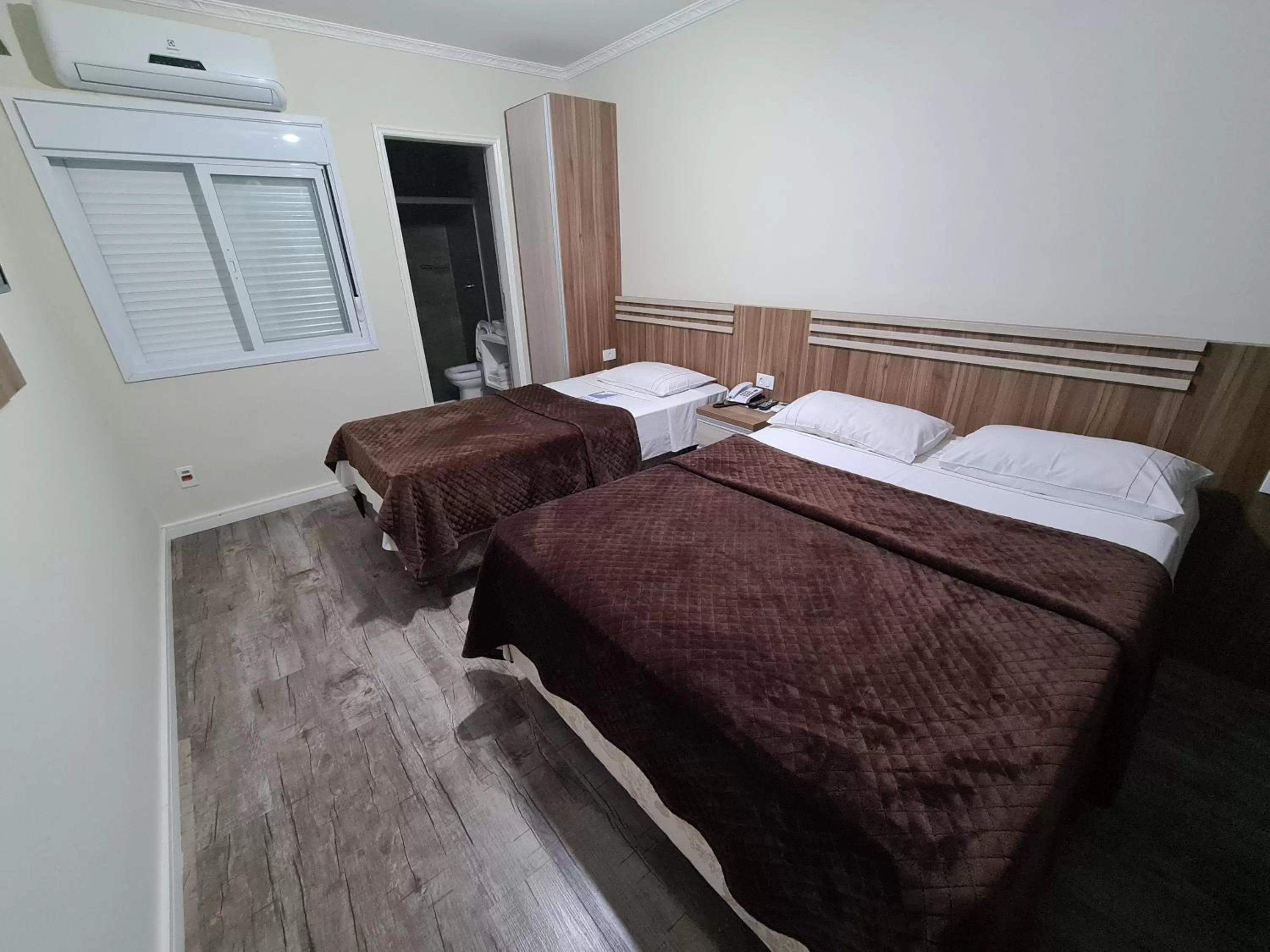 Bed in Bella Augusta Hotel