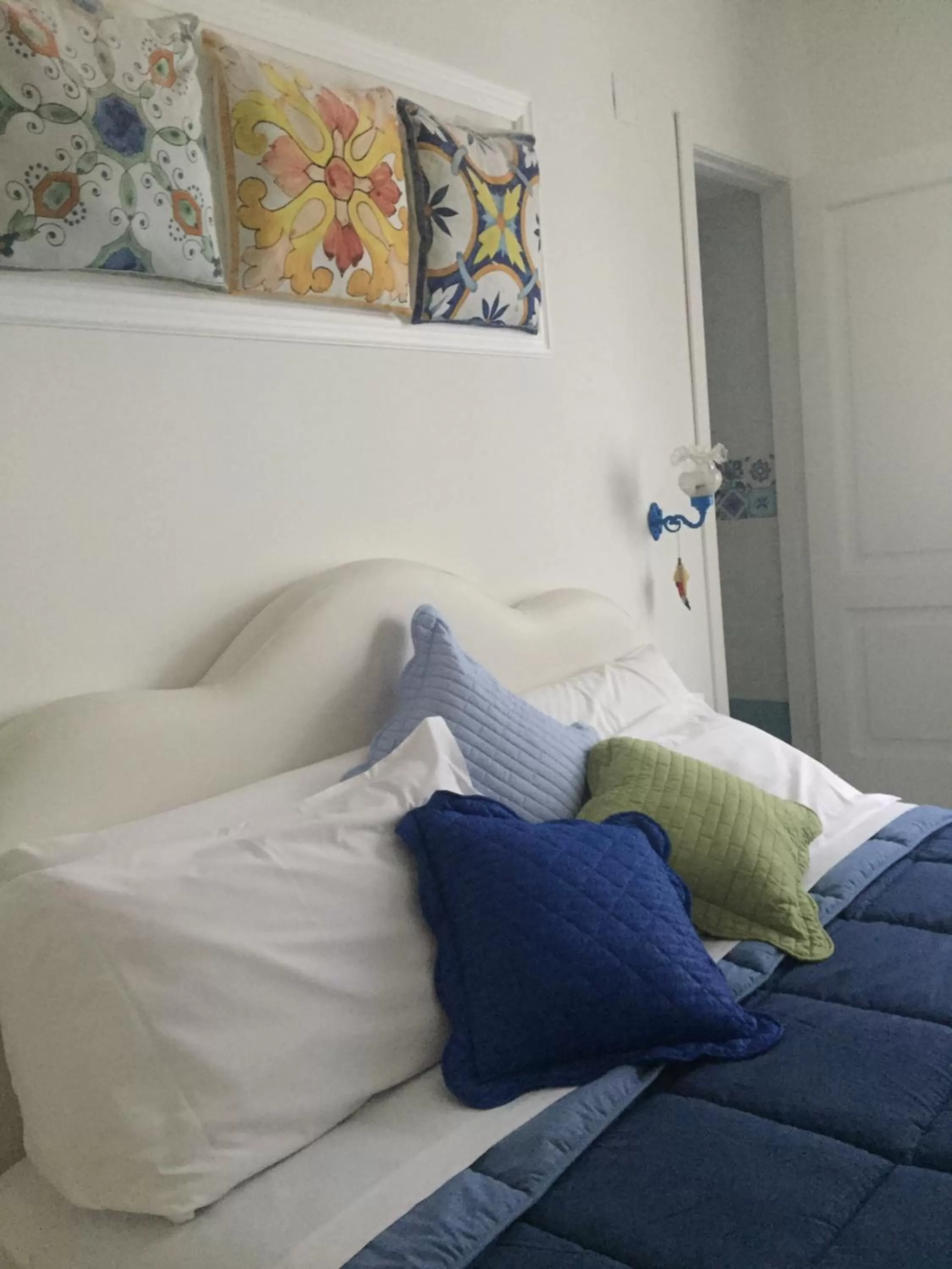 Bed in Sorrento Penthouse Suites