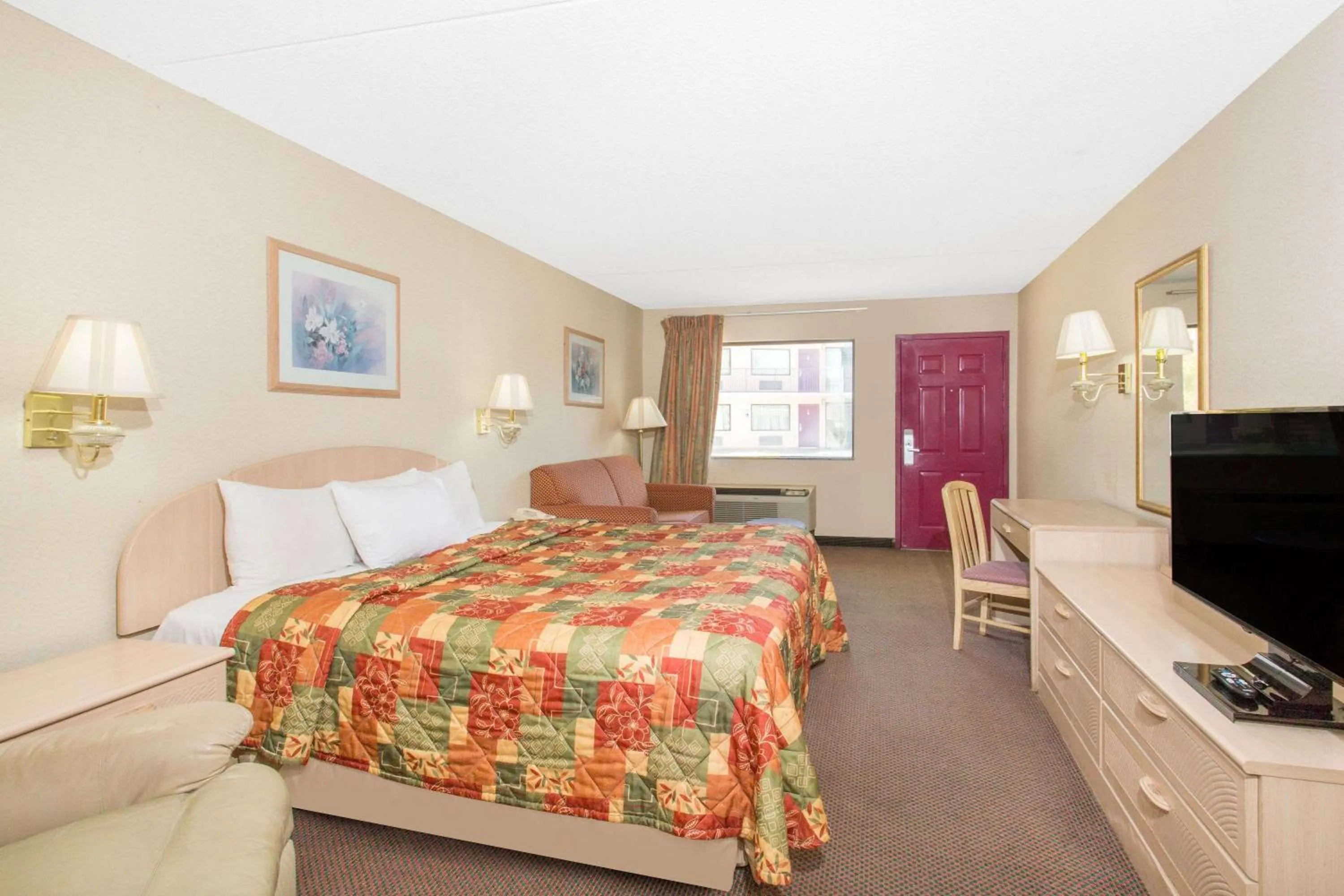 King Room - Smoking  in Days Inn & Suites by Wyndham Bentonville