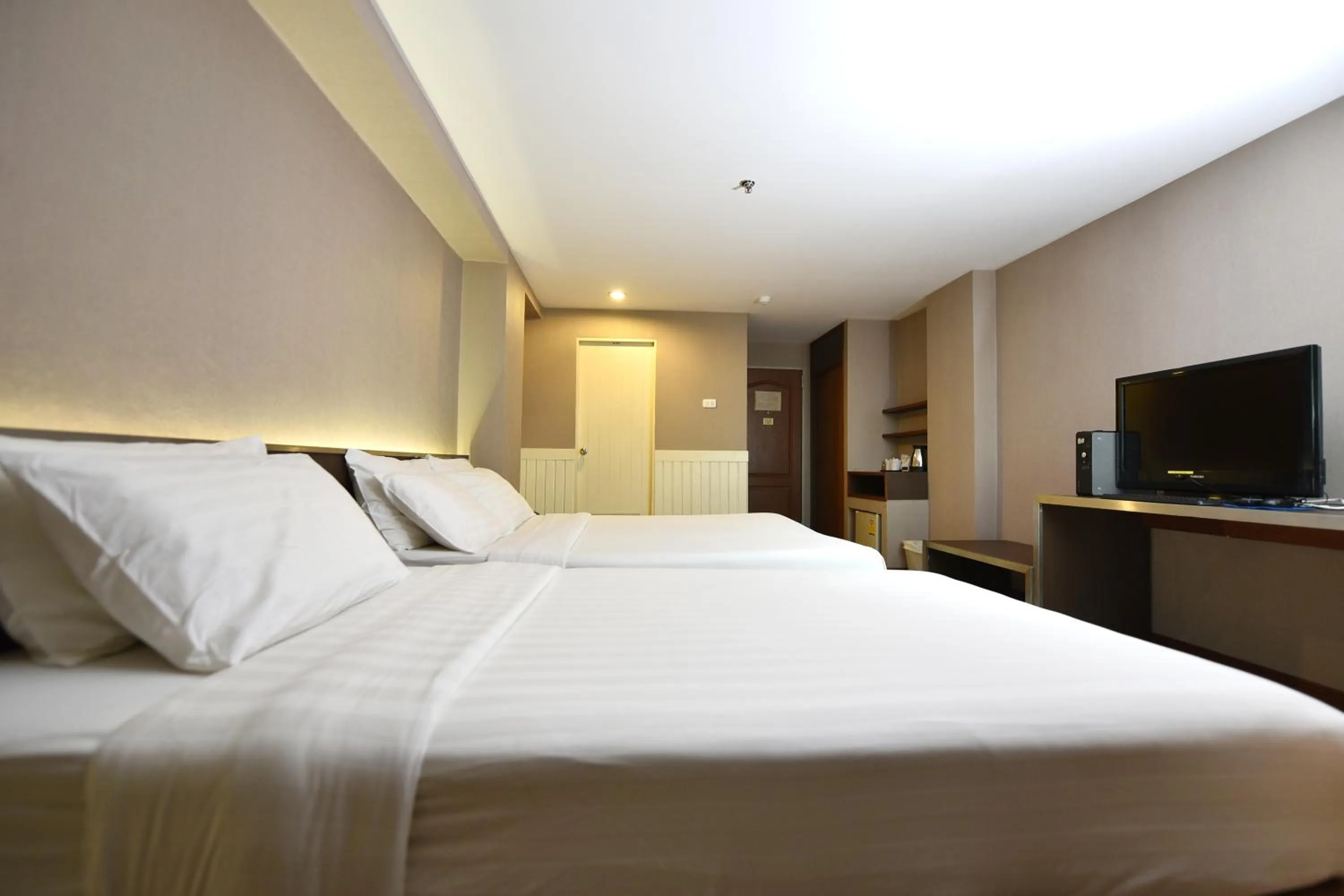 Bed in Bangkok City Suite