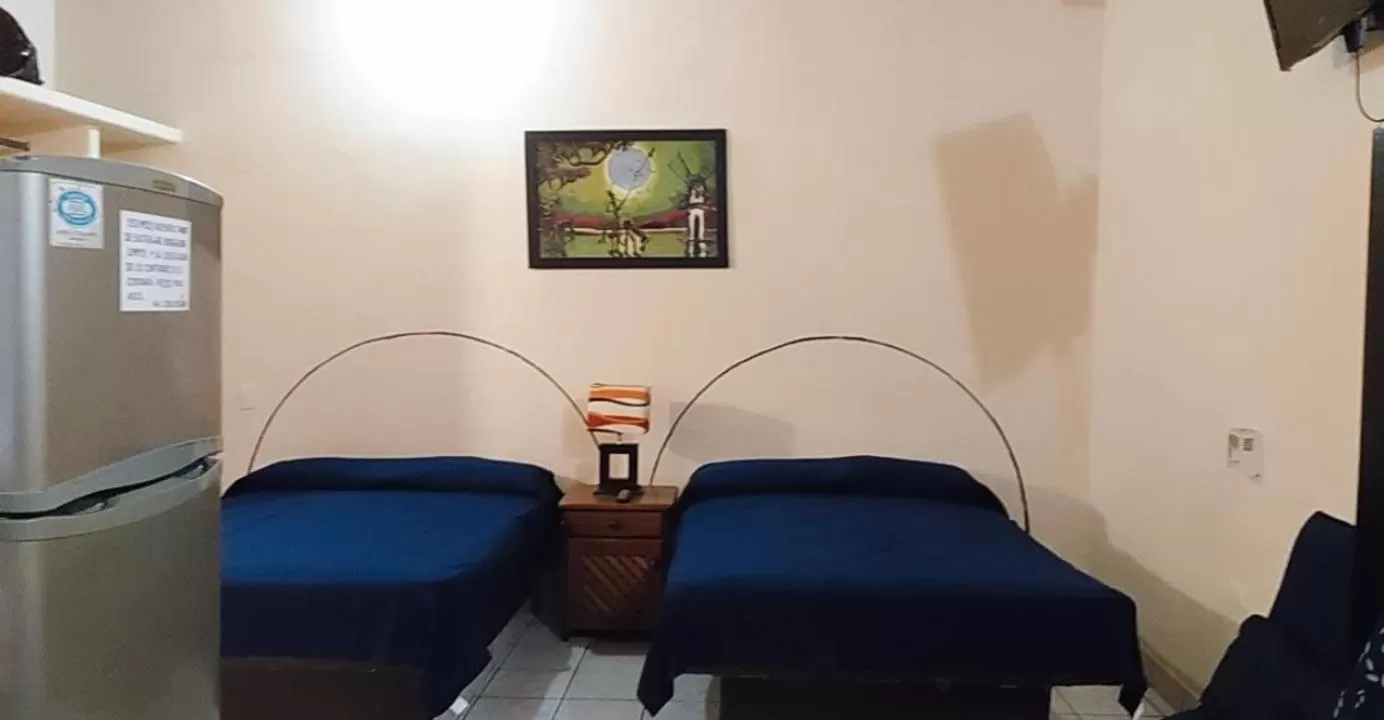 Bed in Bungalows Casa Regina