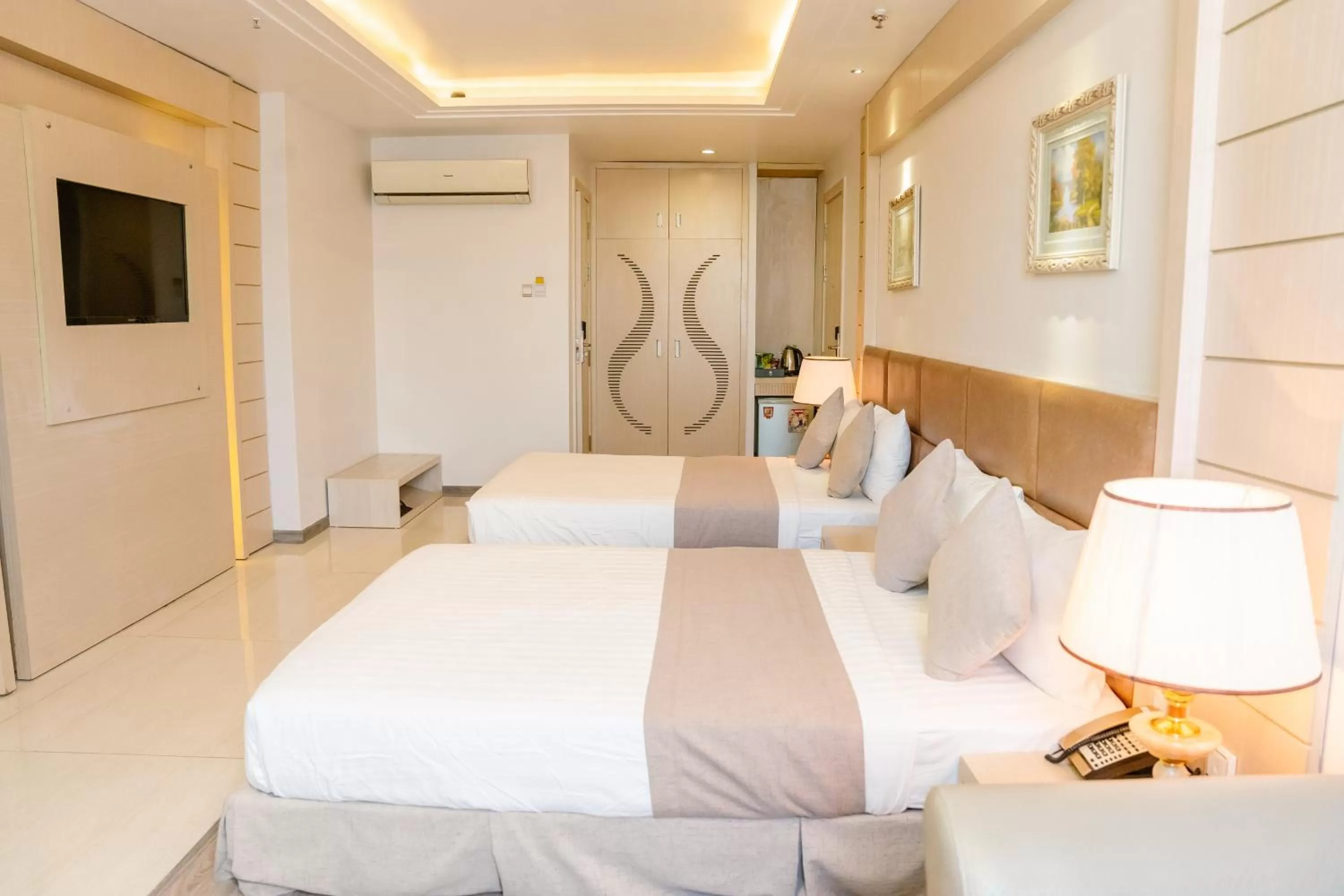 Bed in Holiday One Can Tho Hotel