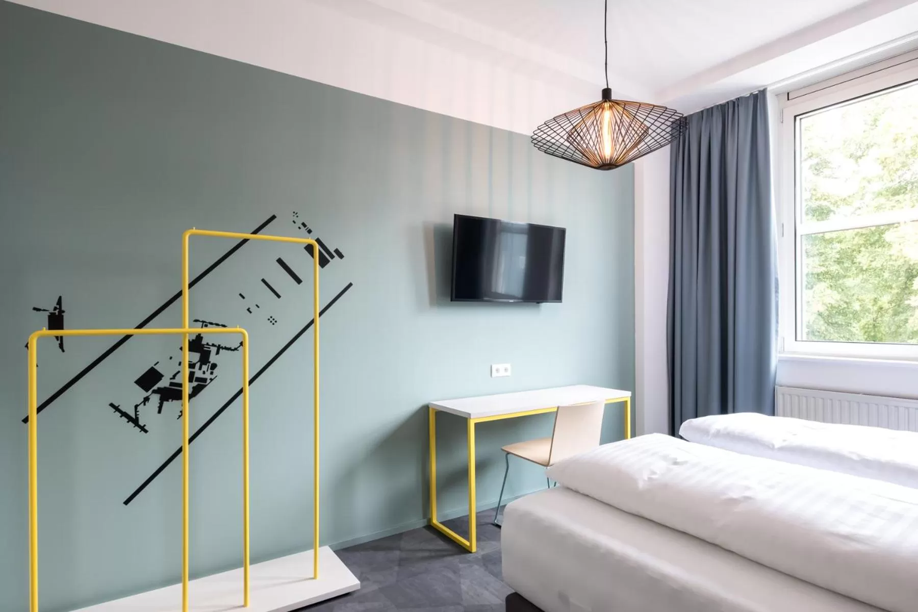 Communal lounge/ TV room, Bed in Airbase Hotel