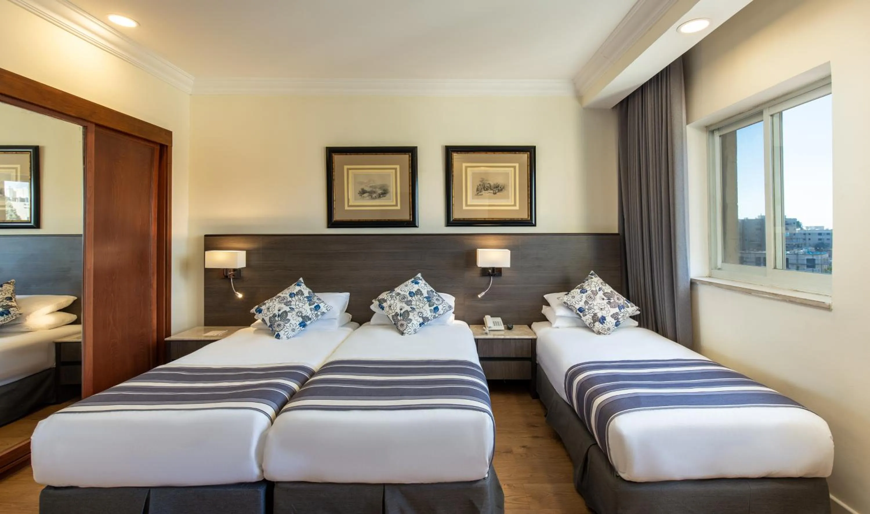 Bed in Ambassador Hotel