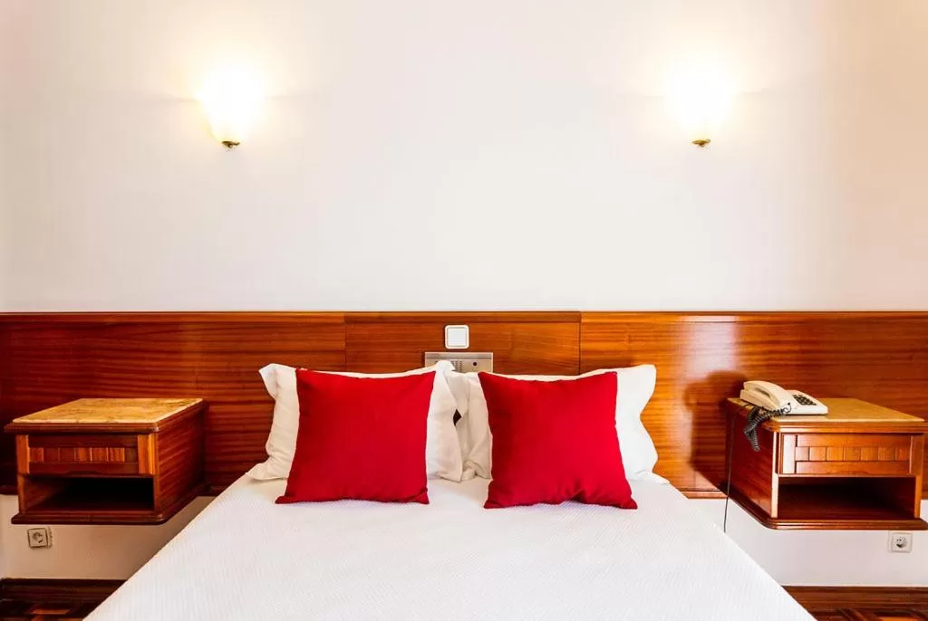 Bed in Dona Amélia Hotel by RIDAN Hotels