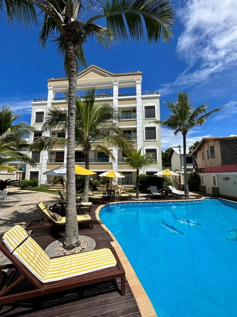 Property building, Swimming Pool in Golfinhos Apart Hotel