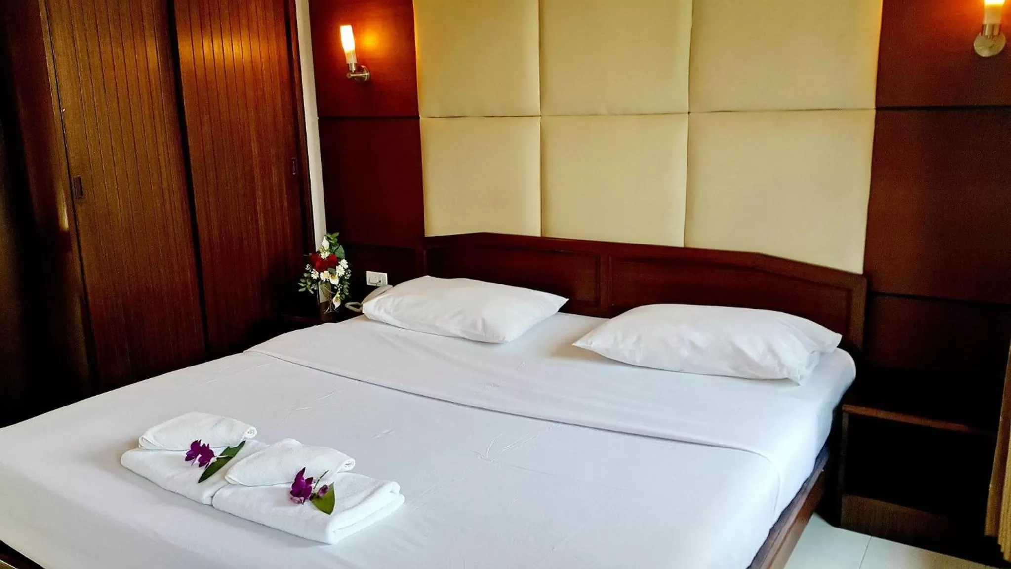 Bed in Areena Resort and Hotel Uttaradit