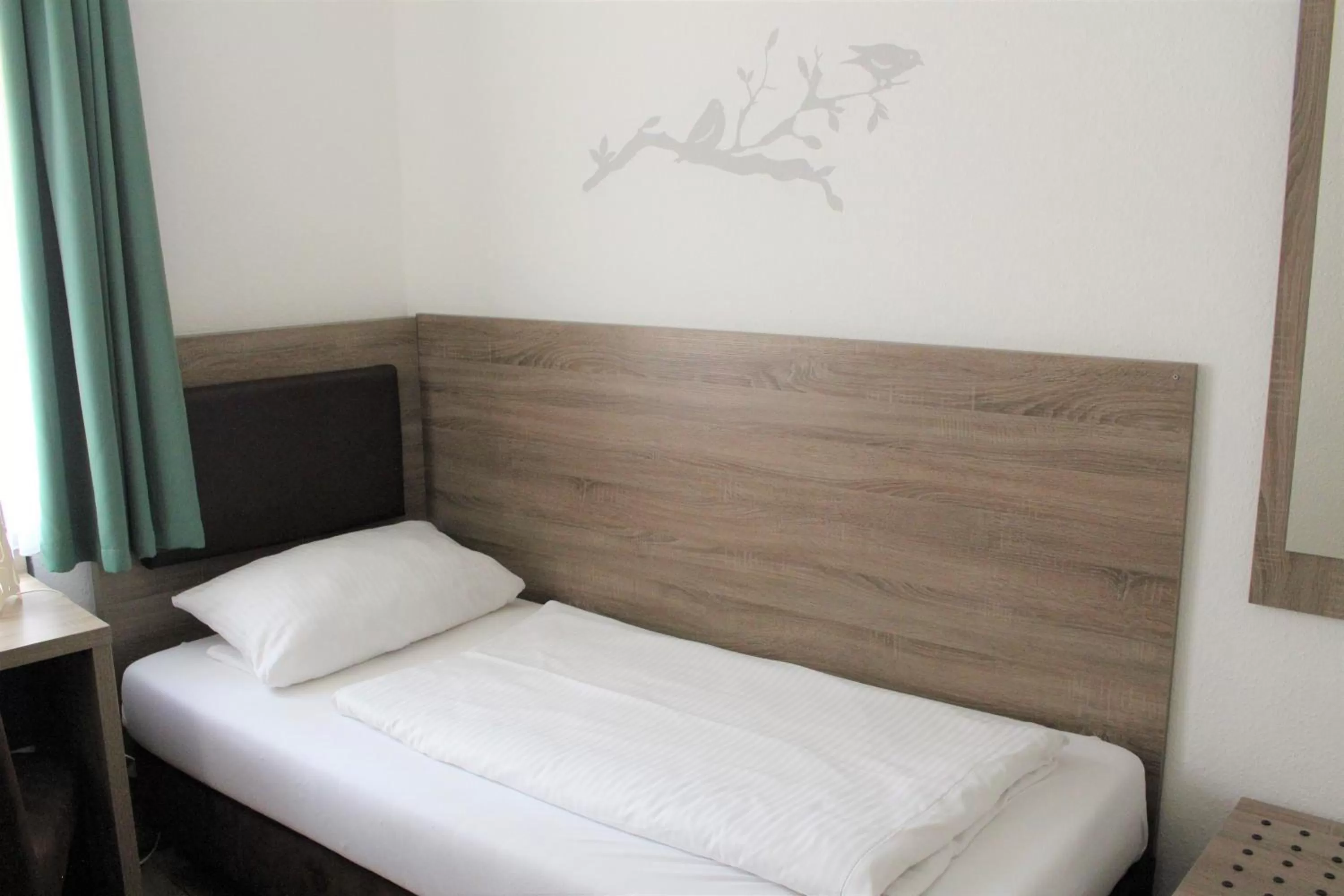 Bed in Hotel Ulmer Spatz