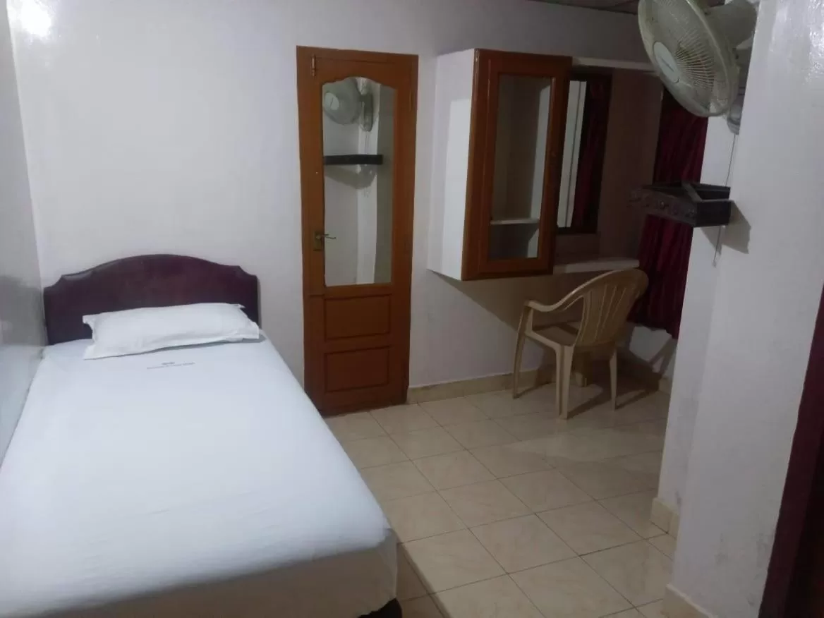 Bed in Anandan Tourist Home