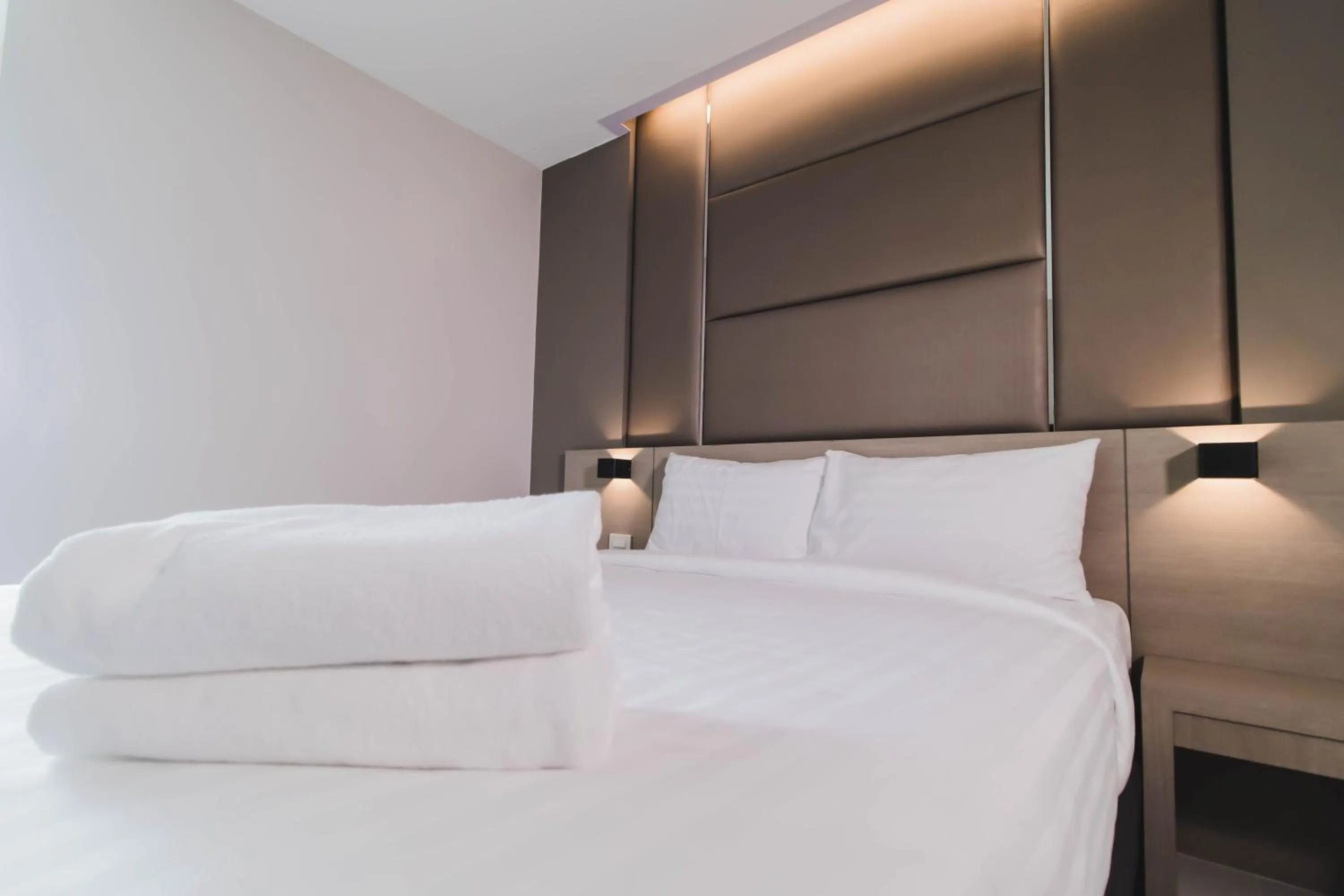 Bed in So good Hotel Bangkok