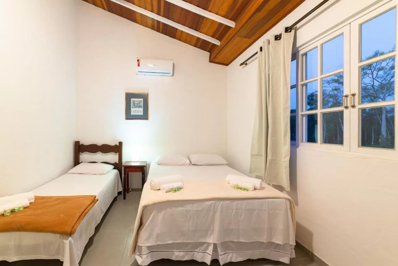 Bed in Pousada Portal de Paraty