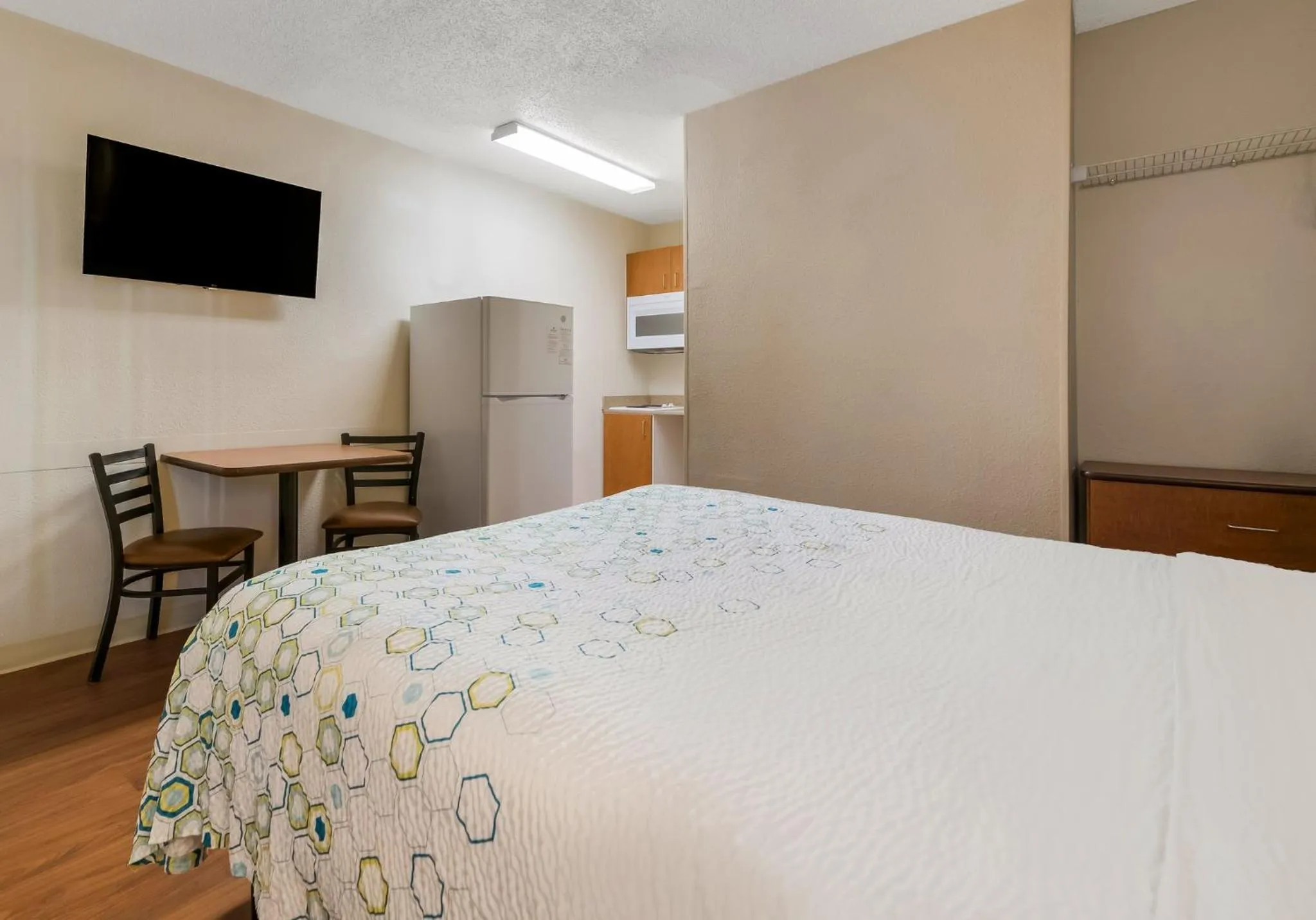 Bedroom, Bed in HomeTowne Studios by Red Roof Orlando - UCF Area